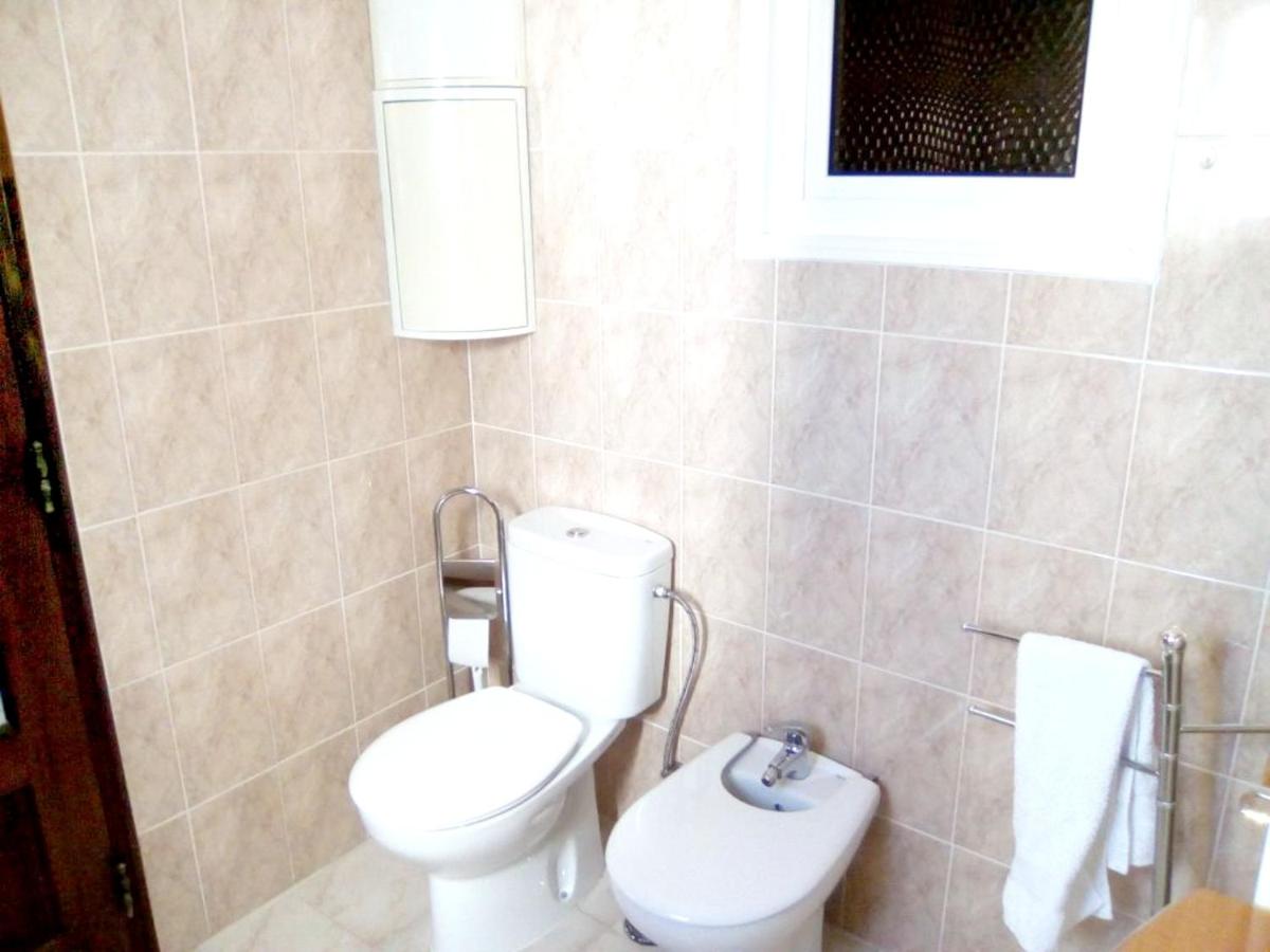 4 bedrooms house with shared pool furnished garden and wifi at Corroios 4 km away from the beach