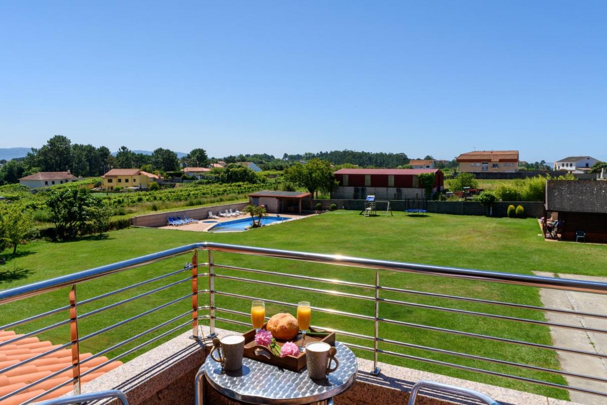 4 bedrooms house with shared pool jacuzzi and enclosed garden at Sanjenjo view 2
