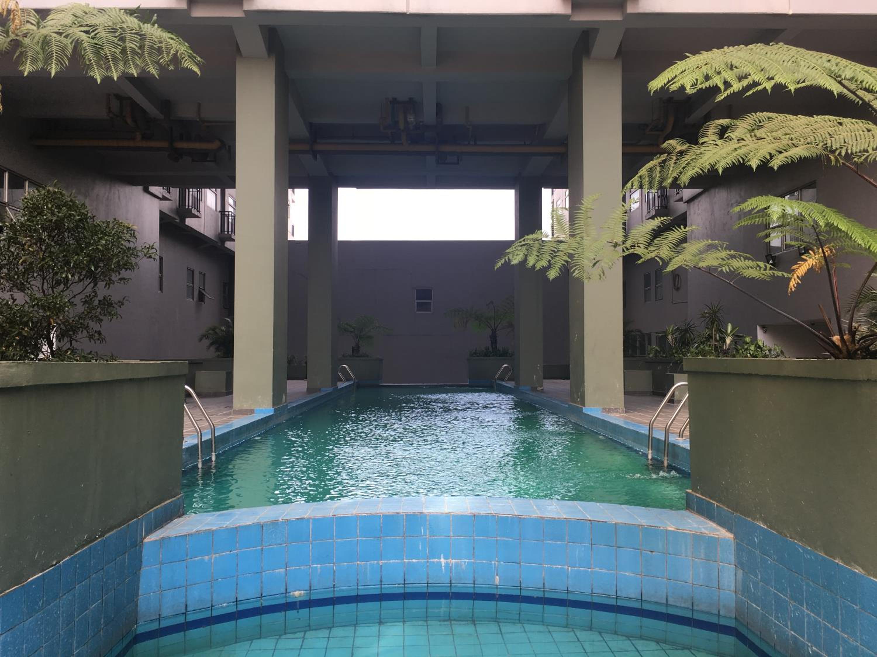 Modern Chic Studio Room at Grand Asia Afrika Apartment By Travelio