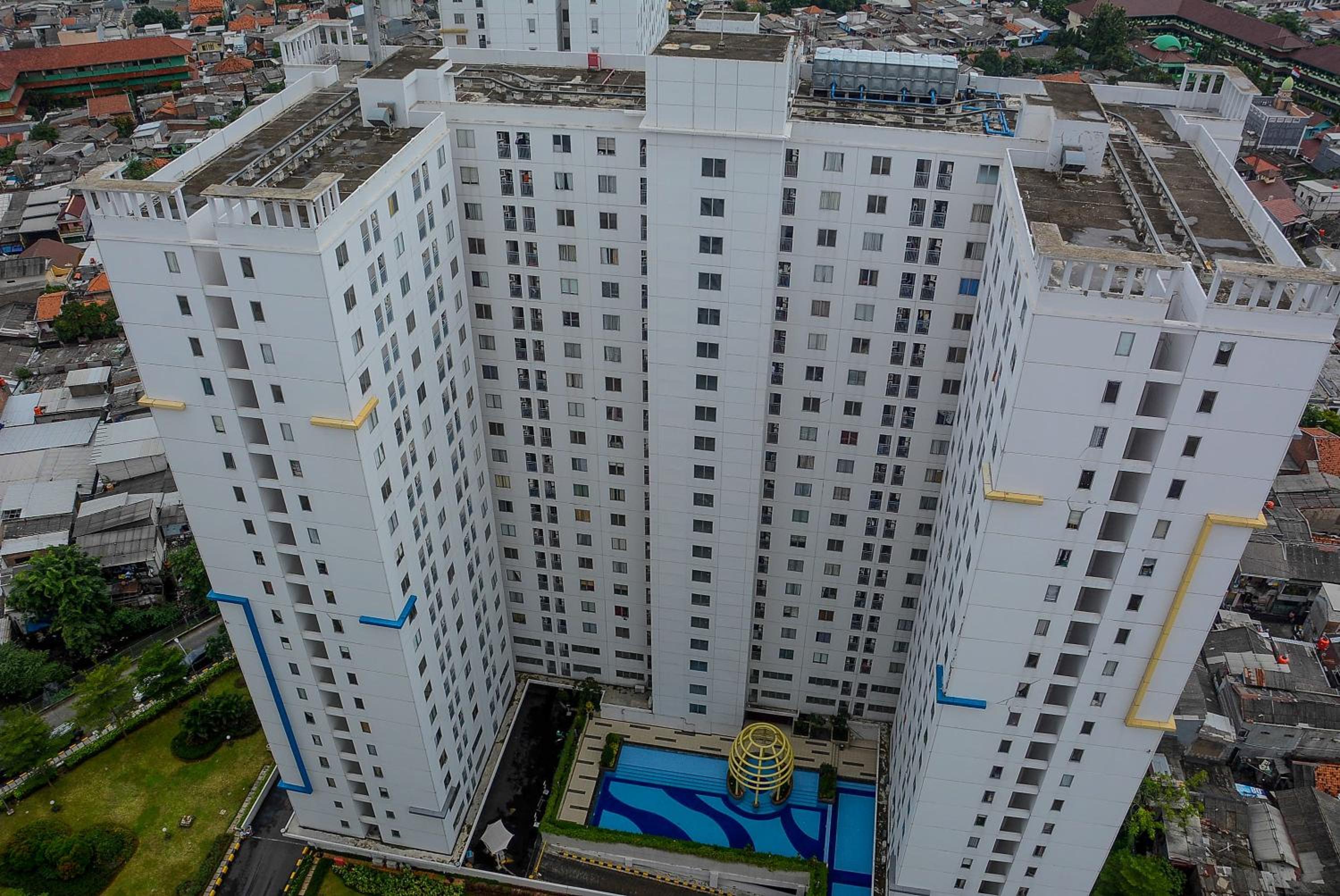 Spacious and Comfy 2BR Bassura City Apartment By Travelio