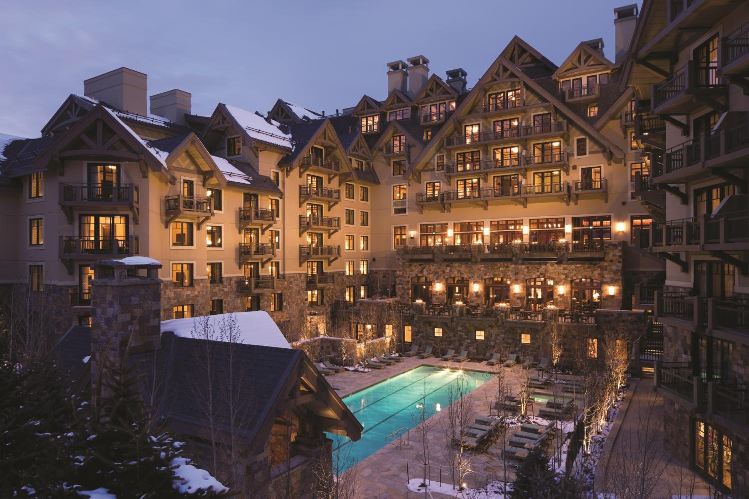 Exterior of Four Seasons Vail during winter showing the heated outdoor pool