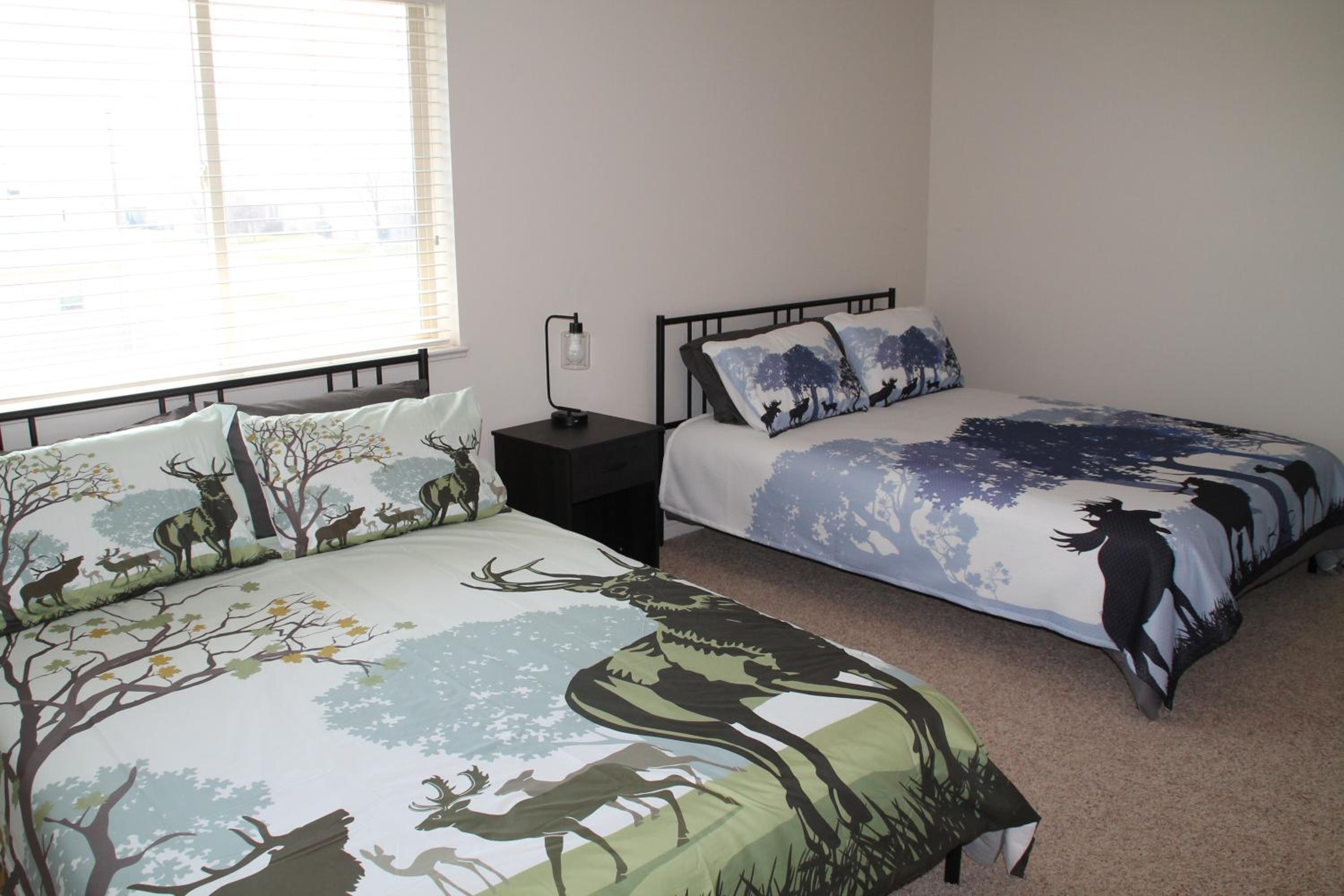 3 queen beds, 1 twin bed, 2 rooms, 1 and a half bath, self check-in, flexcation equipped view 2