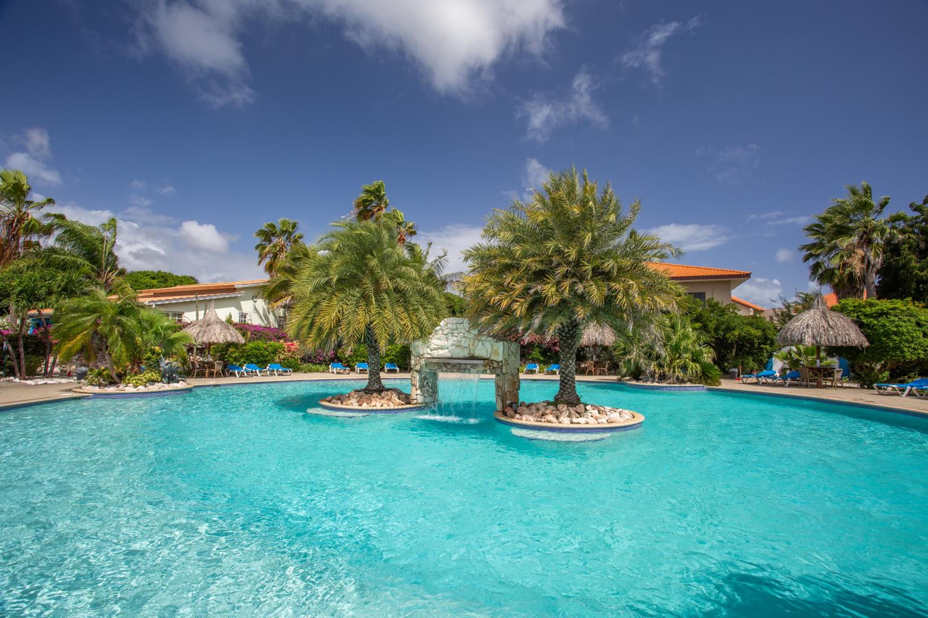 Studio at the pool in tropical Resort Seru Coral with privacy and large pool