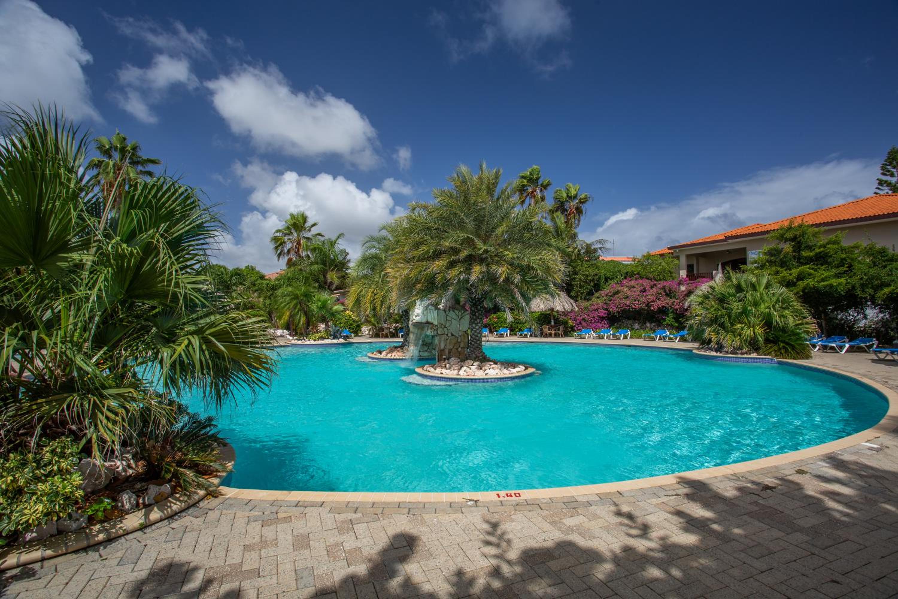 Studio at the pool in tropical Resort Seru Coral with privacy and large pool