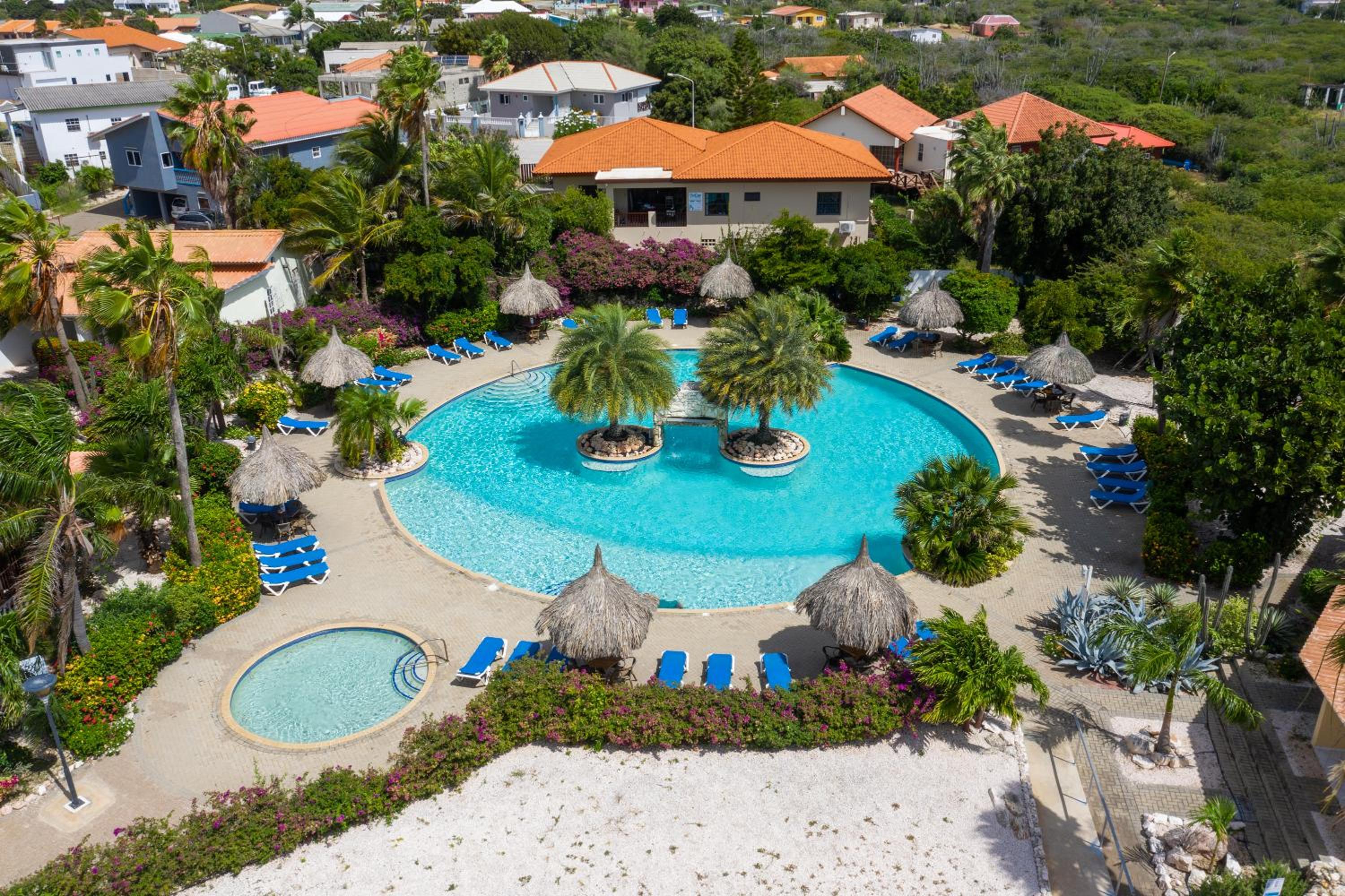 Studio at the pool in tropical Resort Seru Coral with privacy and large pool