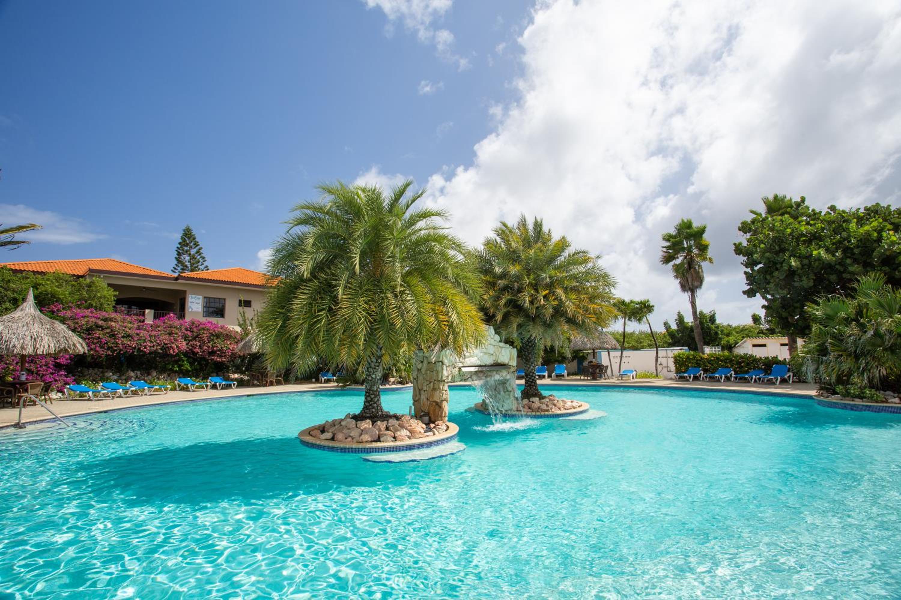 Studio at the pool in tropical Resort Seru Coral with privacy and large pool