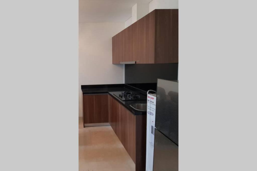 Luxury and Comfort 2 BR Apartment Lavenue Pancoran by Sang Living view 5
