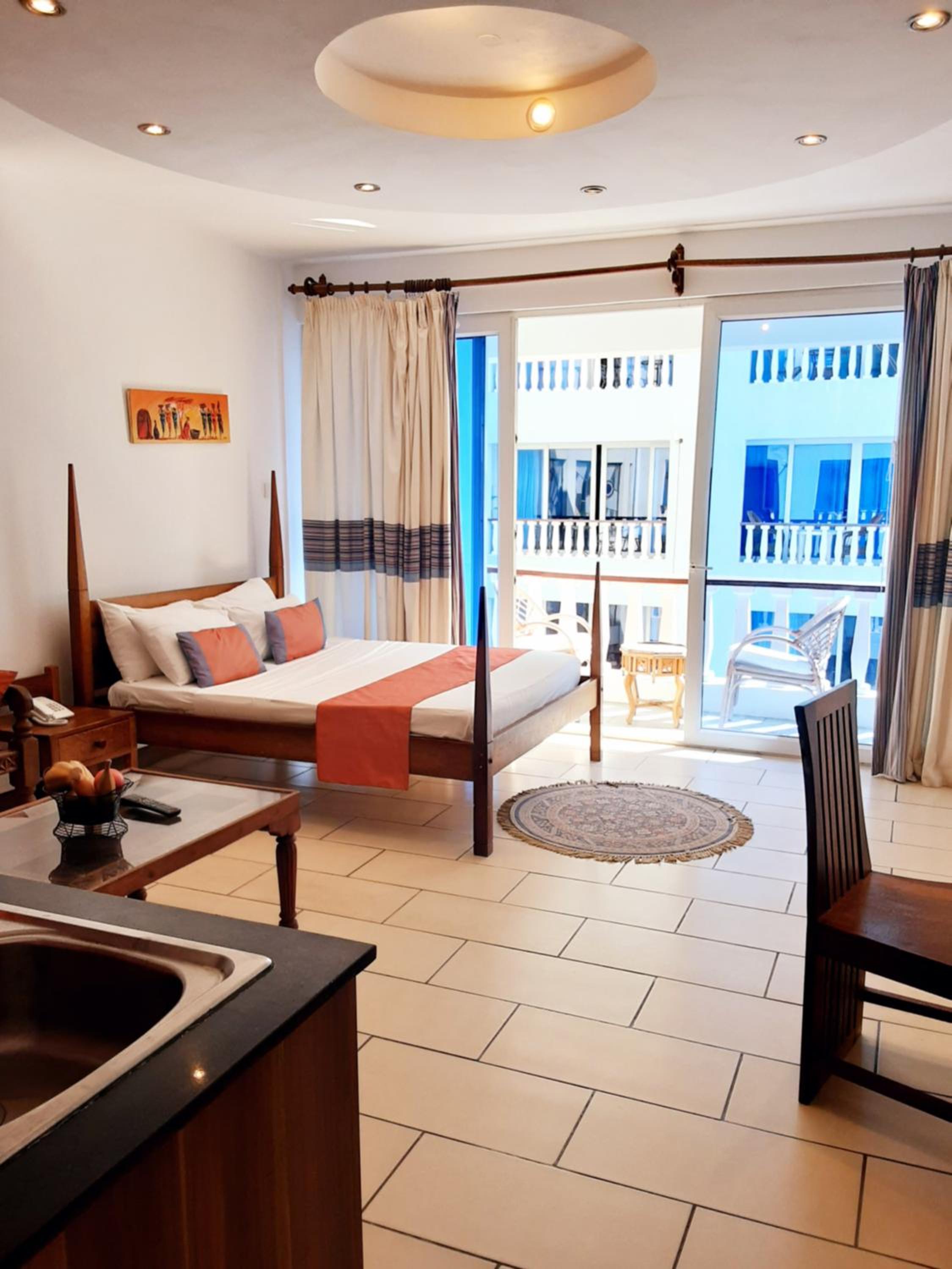Cowrie Shell Beach Apartments Official