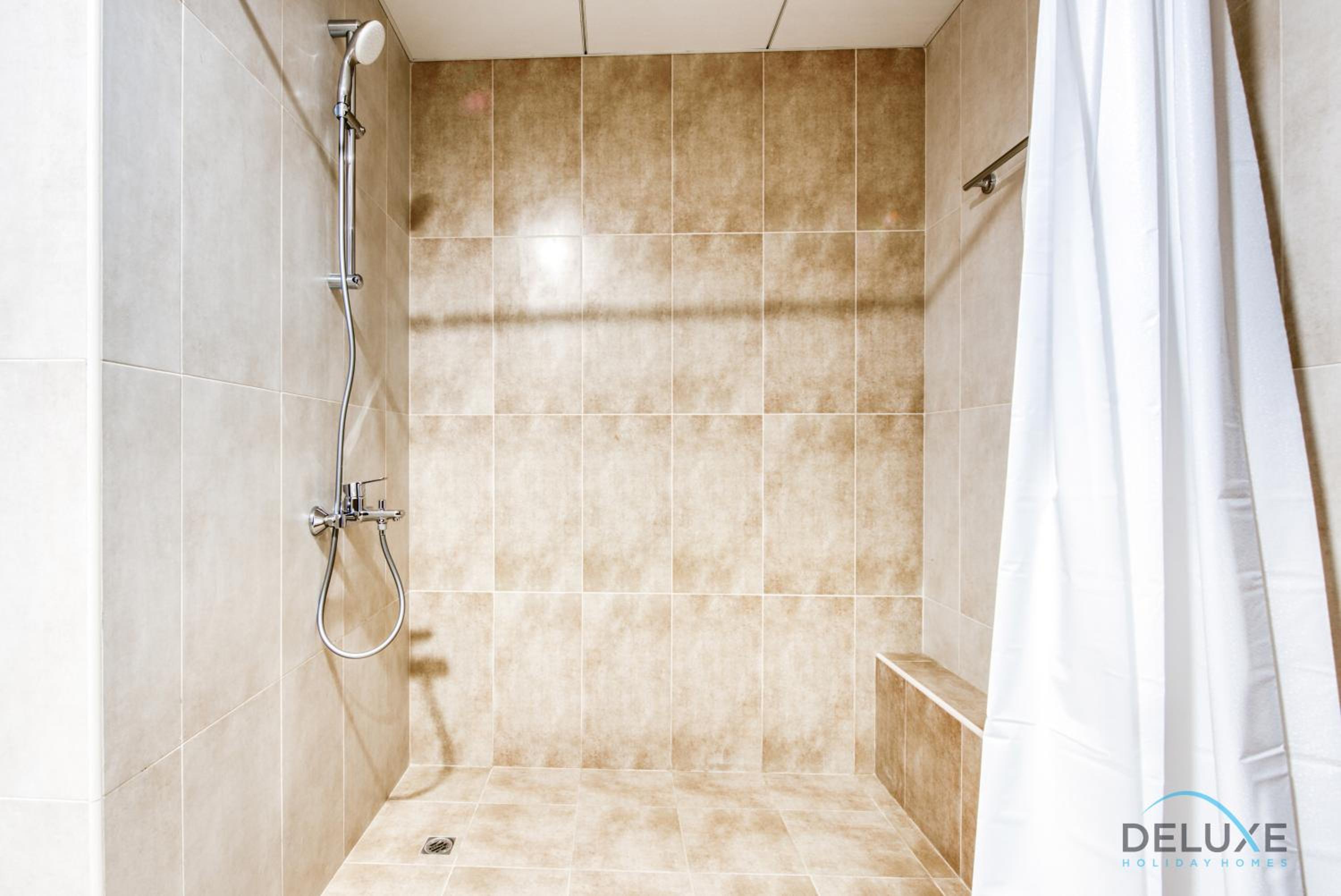 Sunny 1BR at Canal Residences West Dubai Sports City by Deluxe Holiday Homes