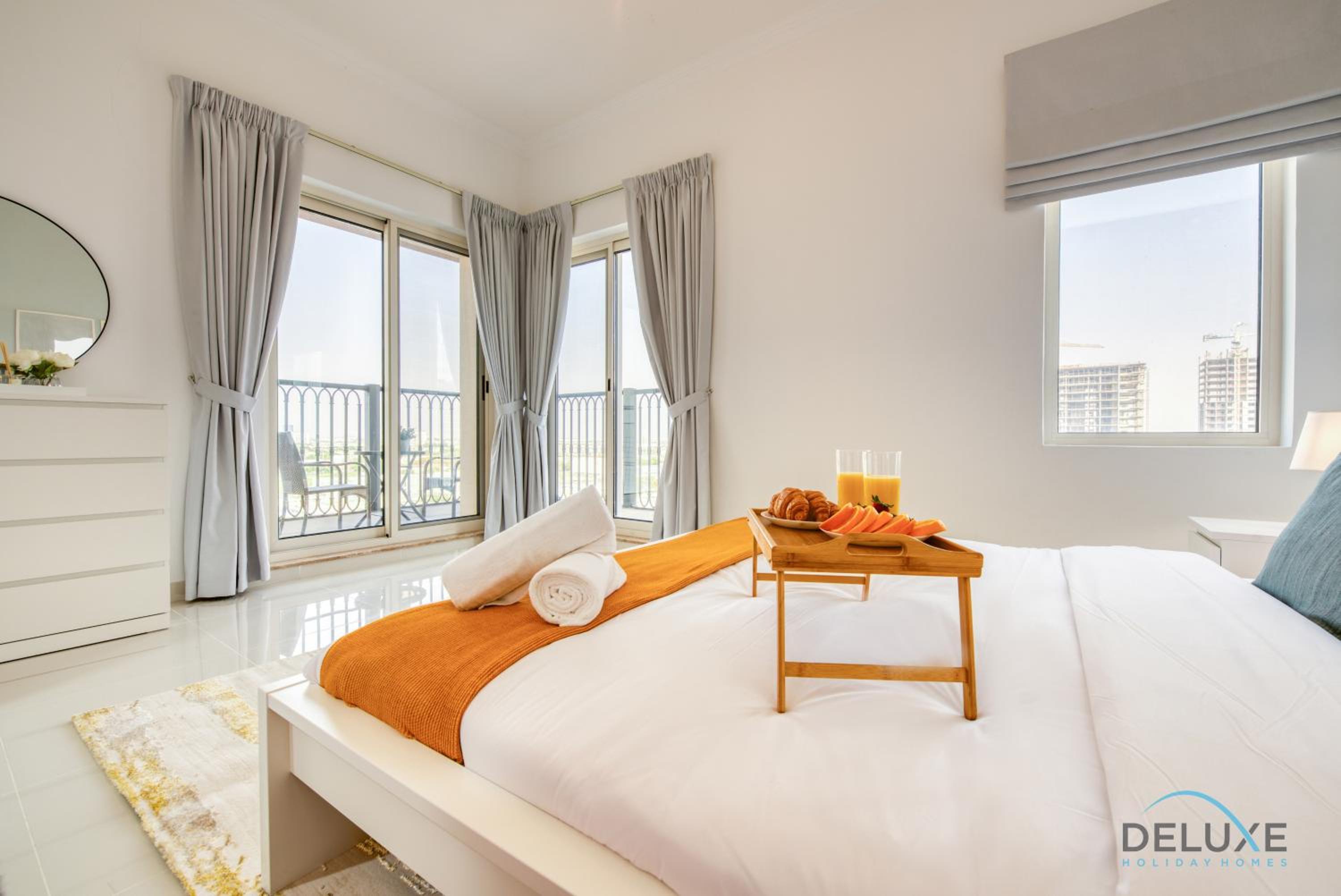 Sunny 1BR at Canal Residences West Dubai Sports City by Deluxe Holiday Homes