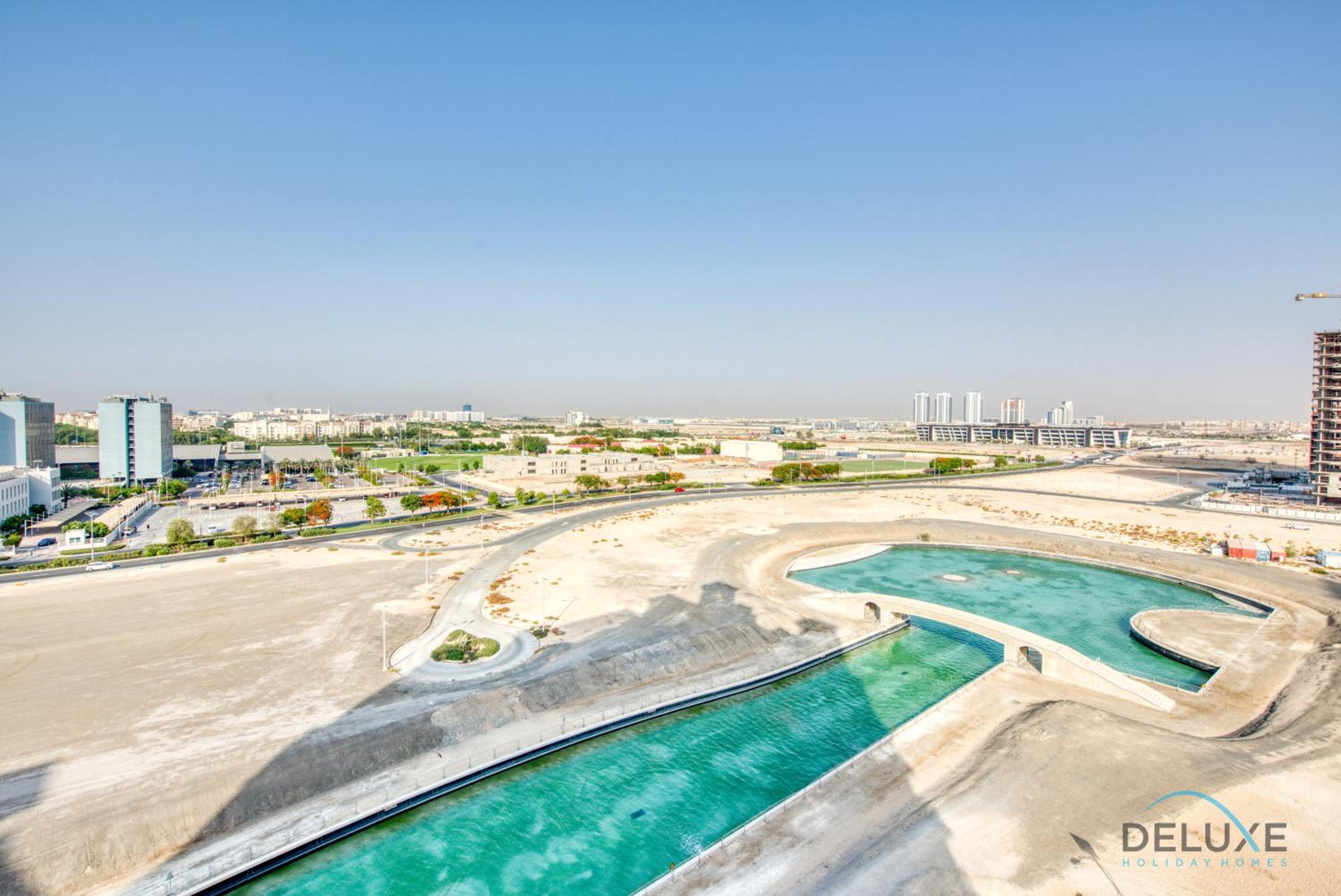Sunny 1BR at Canal Residences West Dubai Sports City by Deluxe Holiday Homes