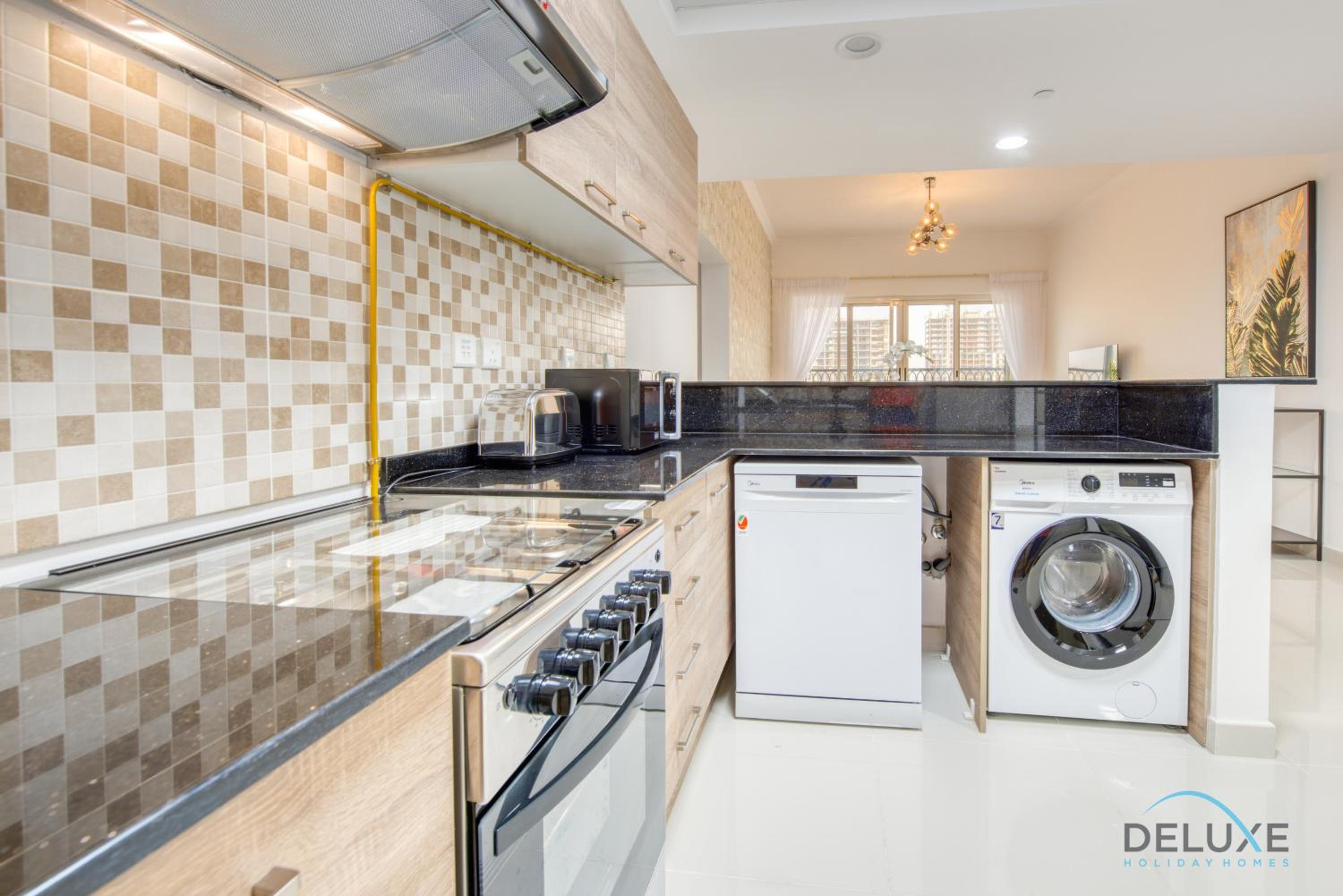 Sunny 1BR at Canal Residences West Dubai Sports City by Deluxe Holiday Homes