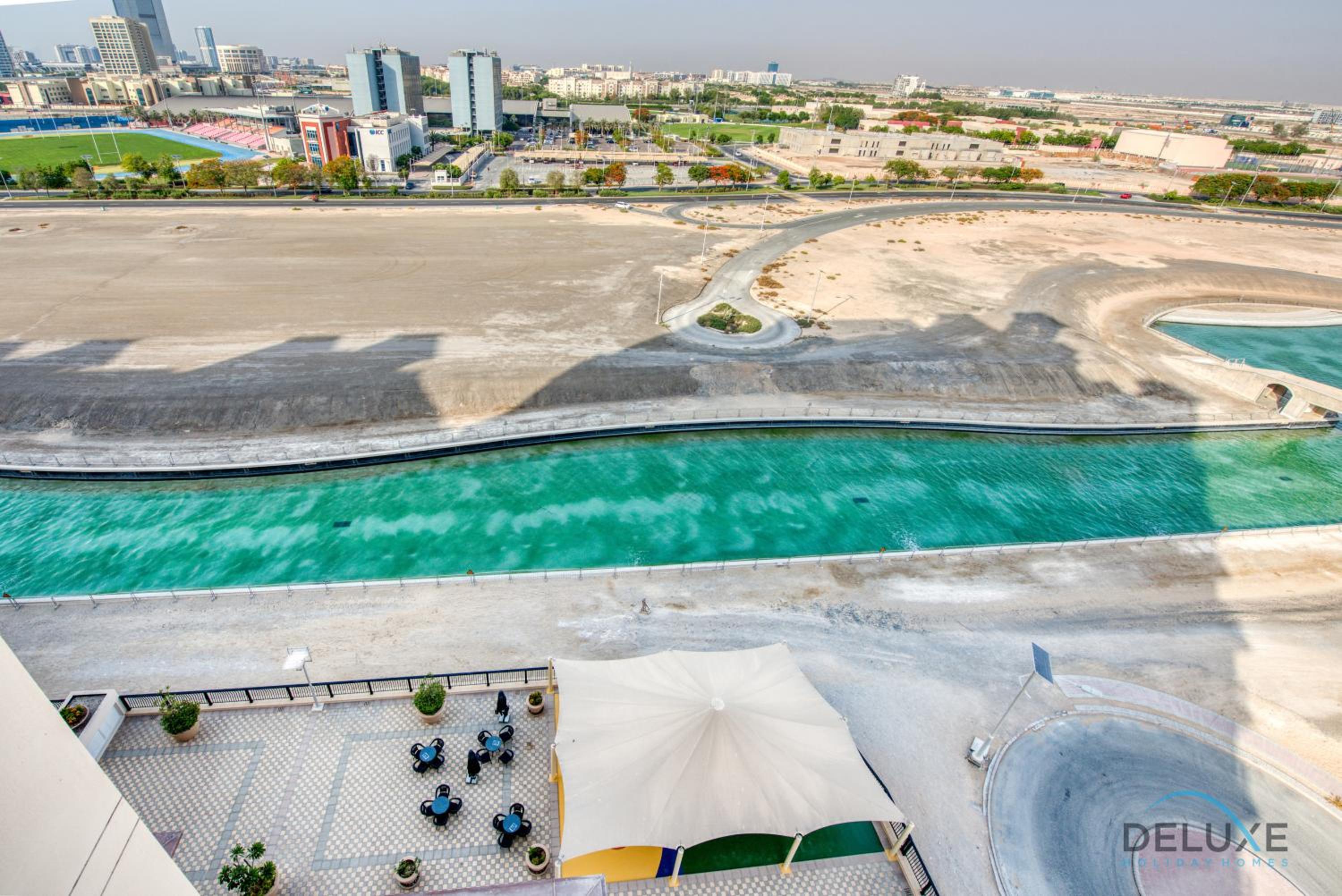 Sunny 1BR at Canal Residences West Dubai Sports City by Deluxe Holiday Homes