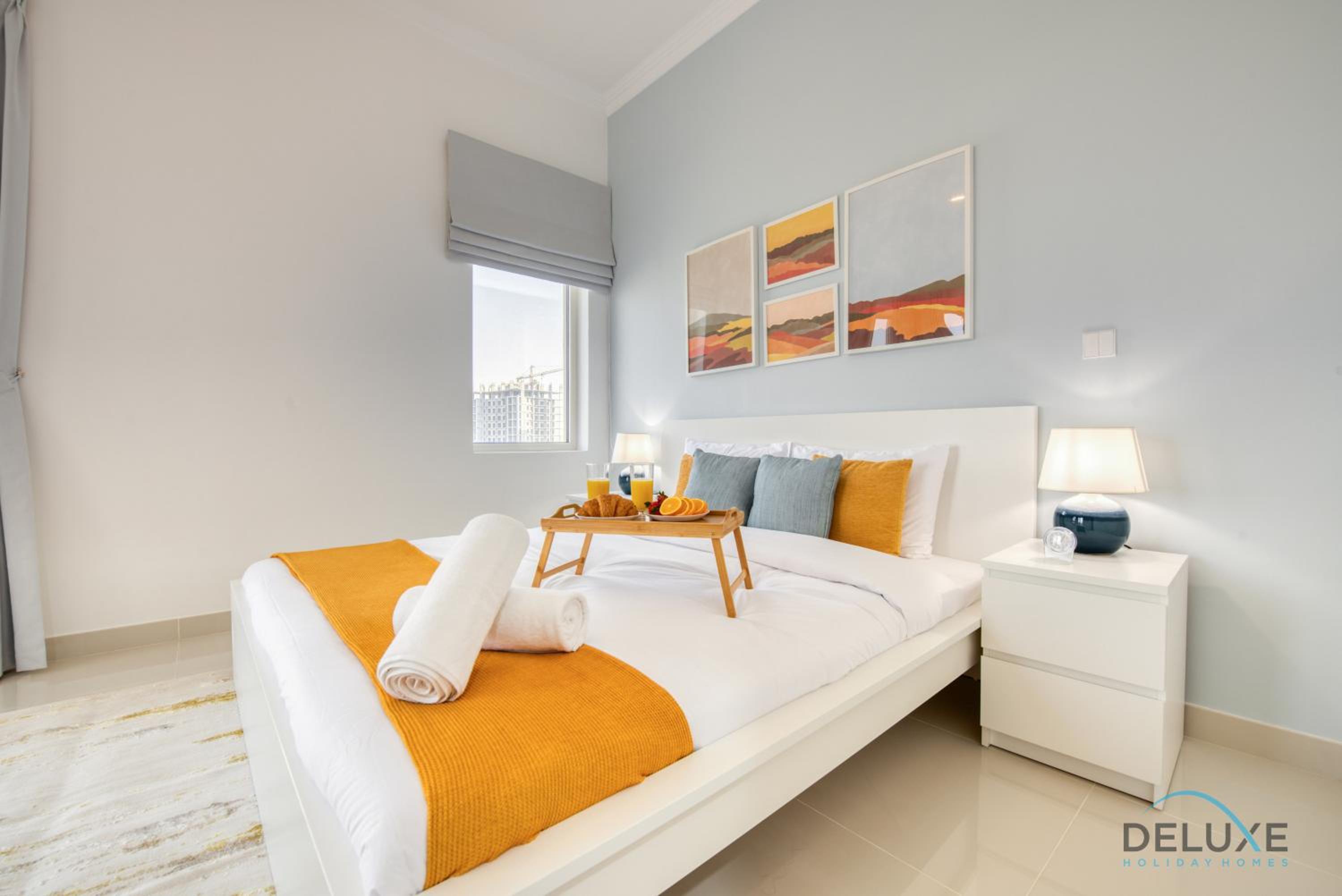 Sunny 1BR at Canal Residences West Dubai Sports City by Deluxe Holiday Homes