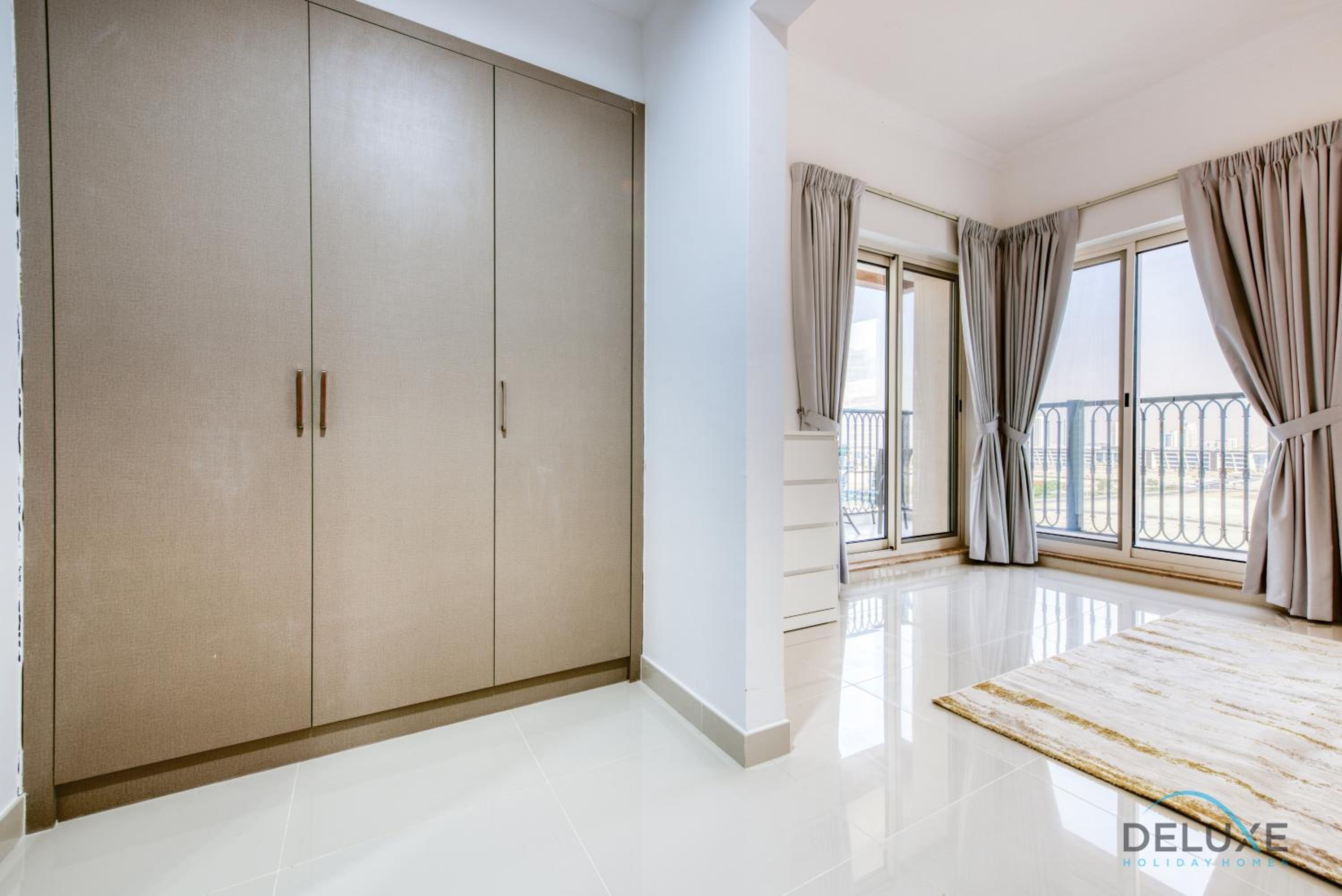 Sunny 1BR at Canal Residences West Dubai Sports City by Deluxe Holiday Homes