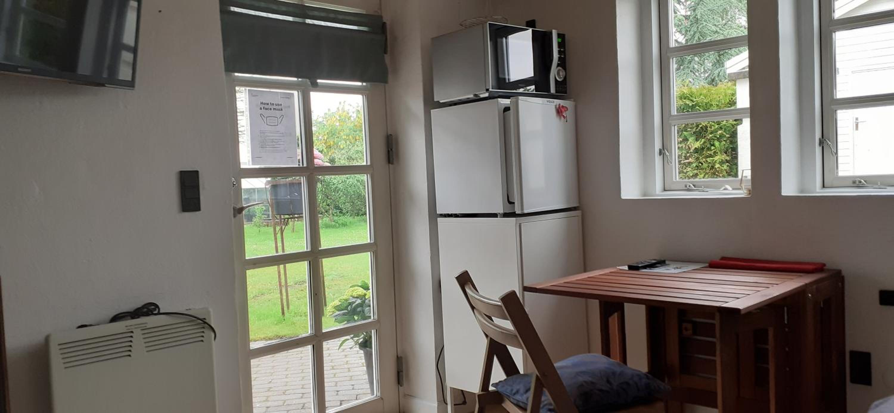 Cozy tiny room, mini kitchen and bathroom view 2