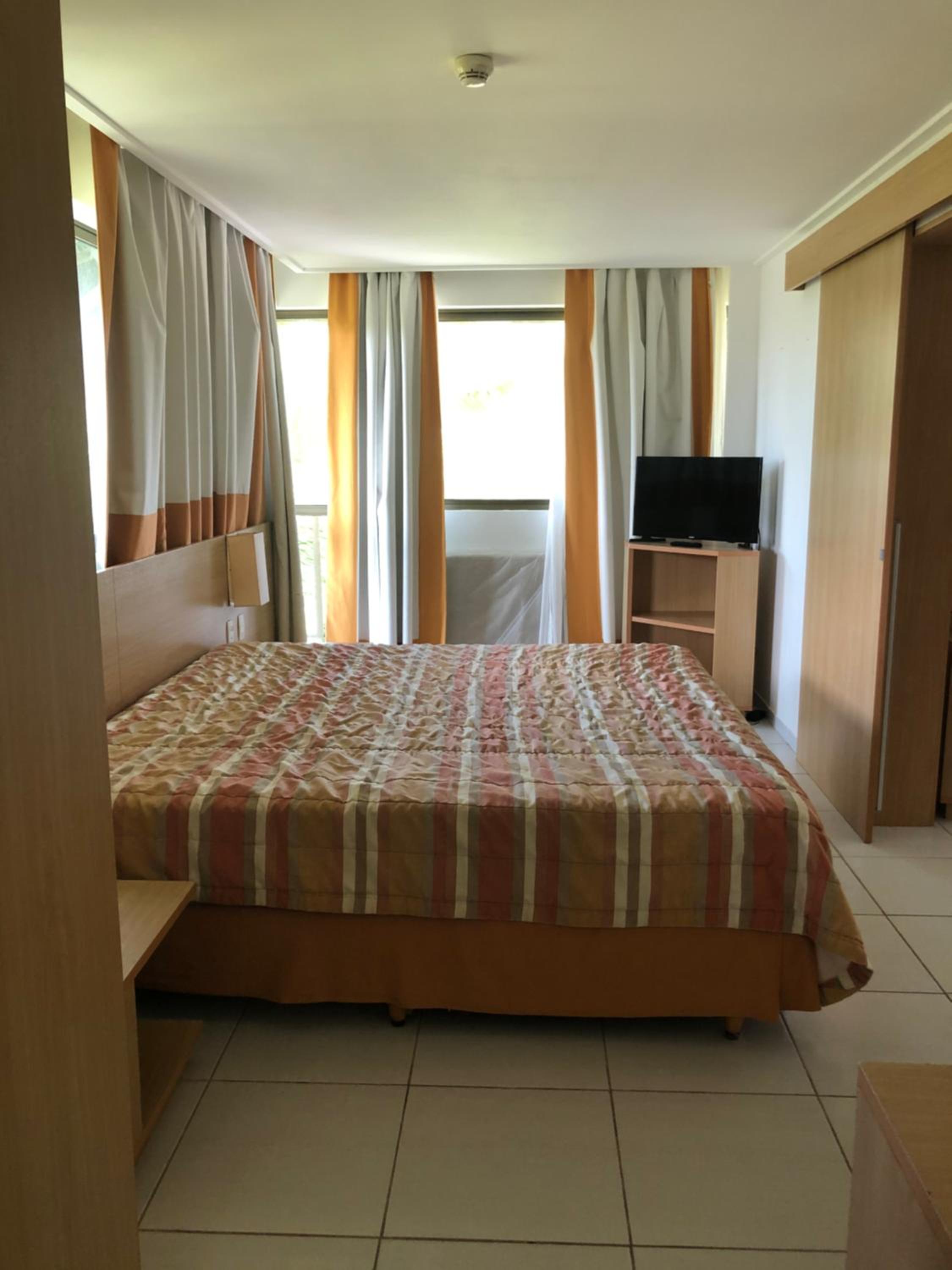 Flat no Beach Class Muro Alto