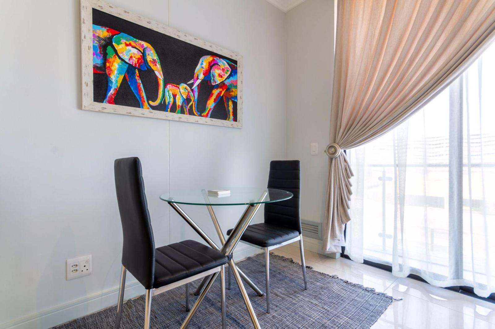 Dining area at Alimama Spaces: The Chelsea's Ellipse, Midrand