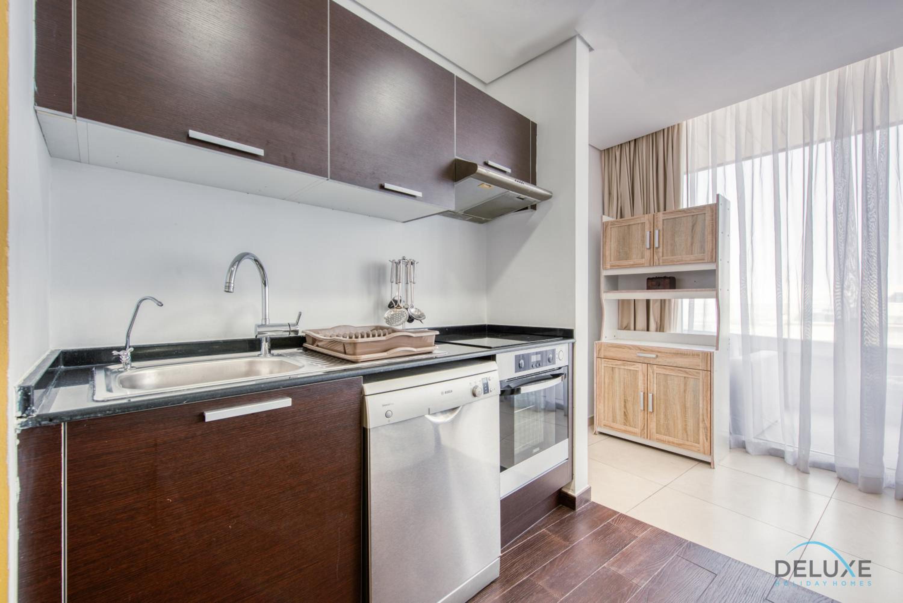 Homely 1BR at The Matrix Dubai Sports City by Deluxe Holiday Homes