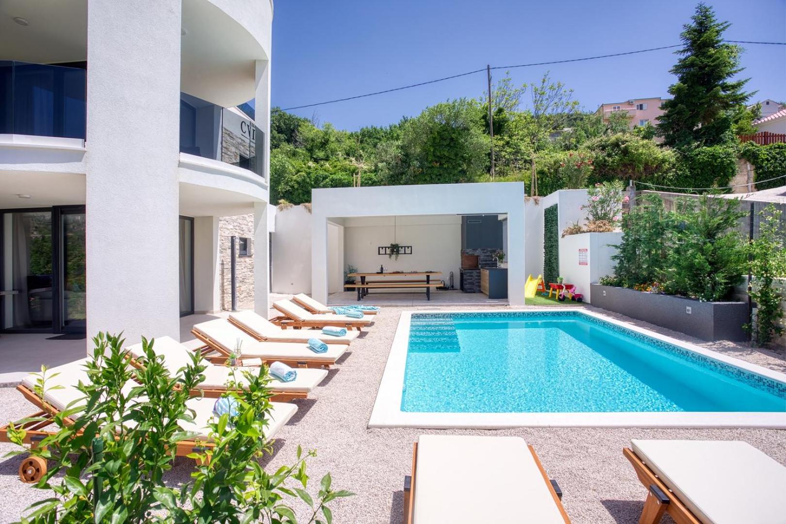 VILLA CVITA is a modern 5-bedroom villa with a Jacuzzi, a Gym and Finnish Sauna, a heated pool, and amazing views view 4