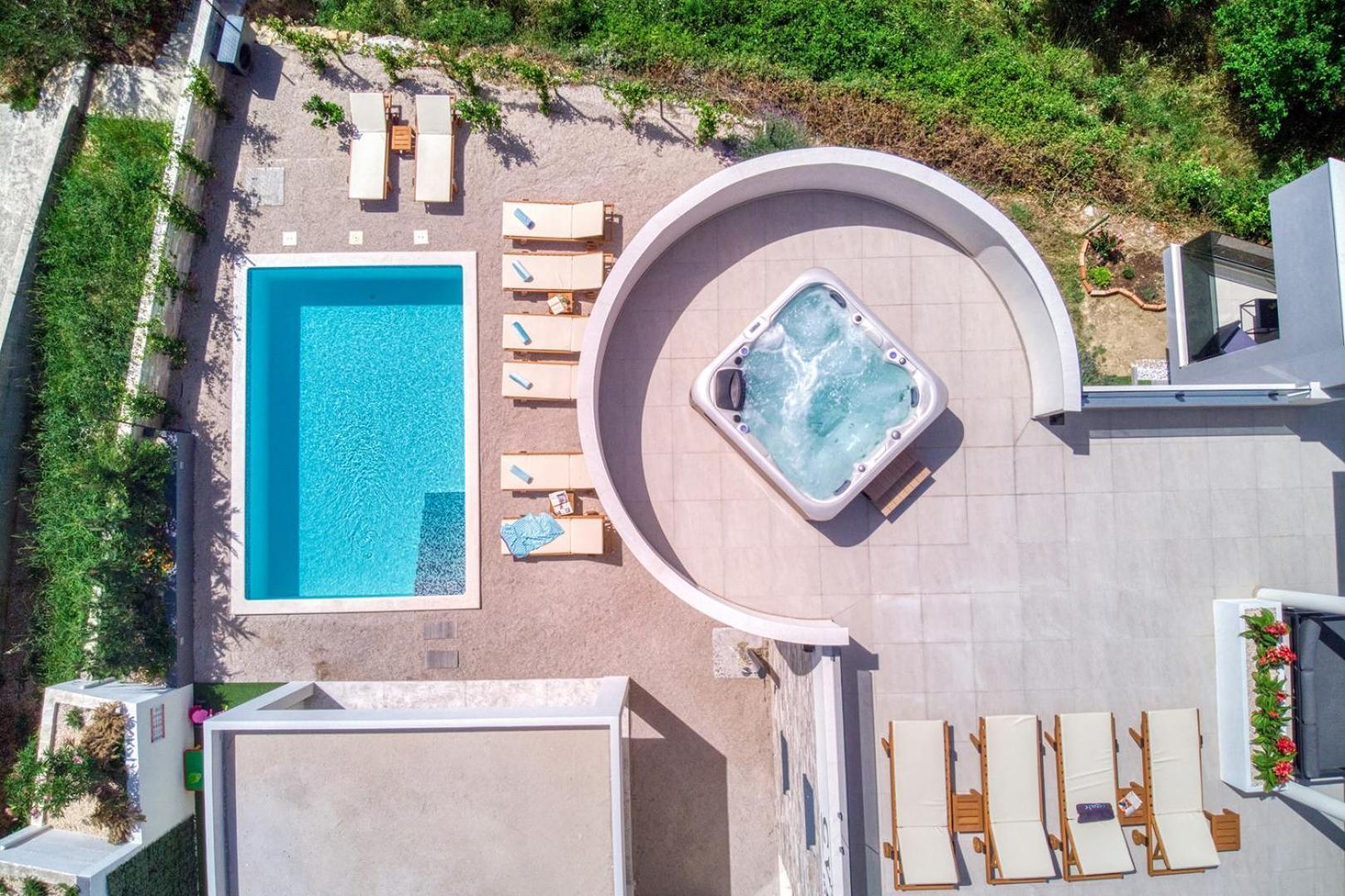 VILLA CVITA is a modern 5-bedroom villa with a Jacuzzi, a Gym and Finnish Sauna, a heated pool, and amazing views view 3
