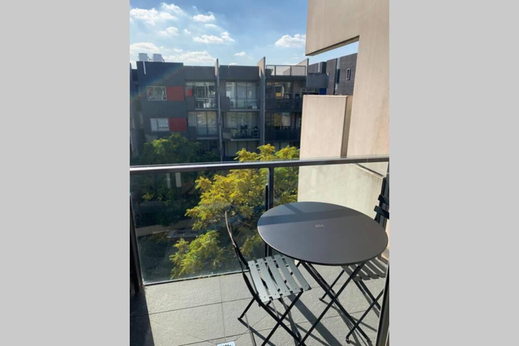 Sunny Balcony Over a Calm Private Garden