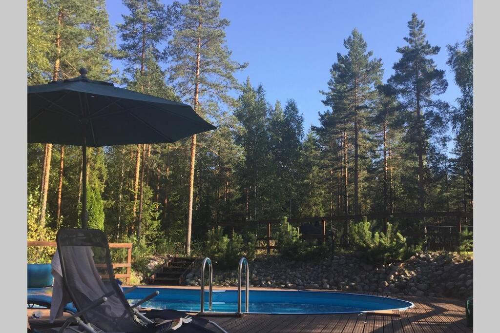Sirpa's Artistic Nuuksio Retreat with Heated Pool