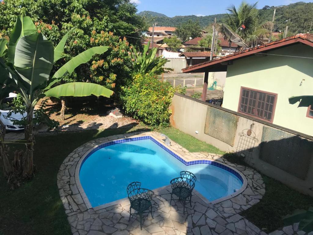 Casa de praia com piscina e clima de montanha