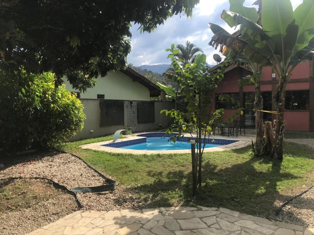 Casa de praia com piscina e clima de montanha