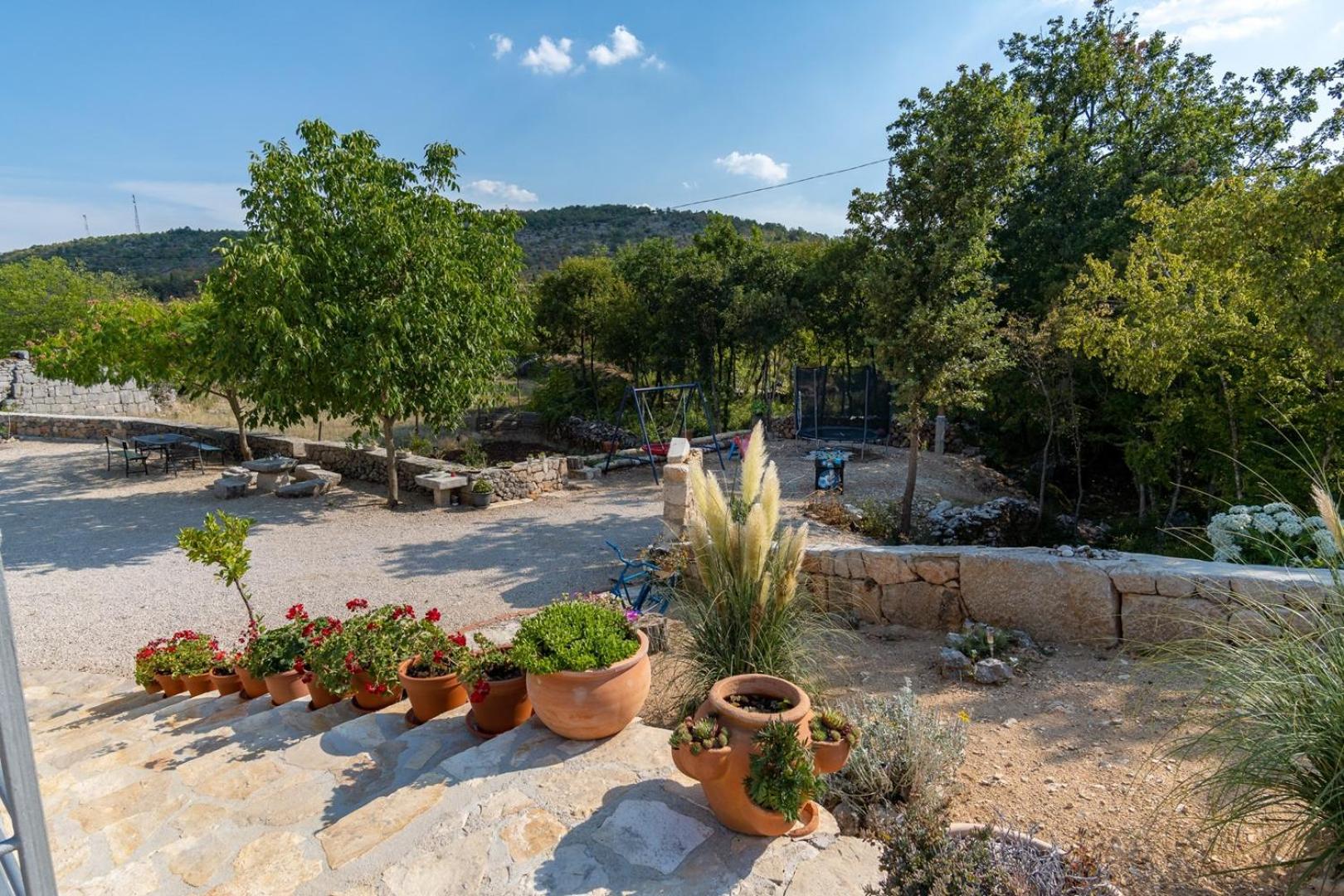 Villa Lugareva with 52 sqm private pool, 4 bedrooms, 4 bathrooms, summer kitchen, traditional environment, playground view 2
