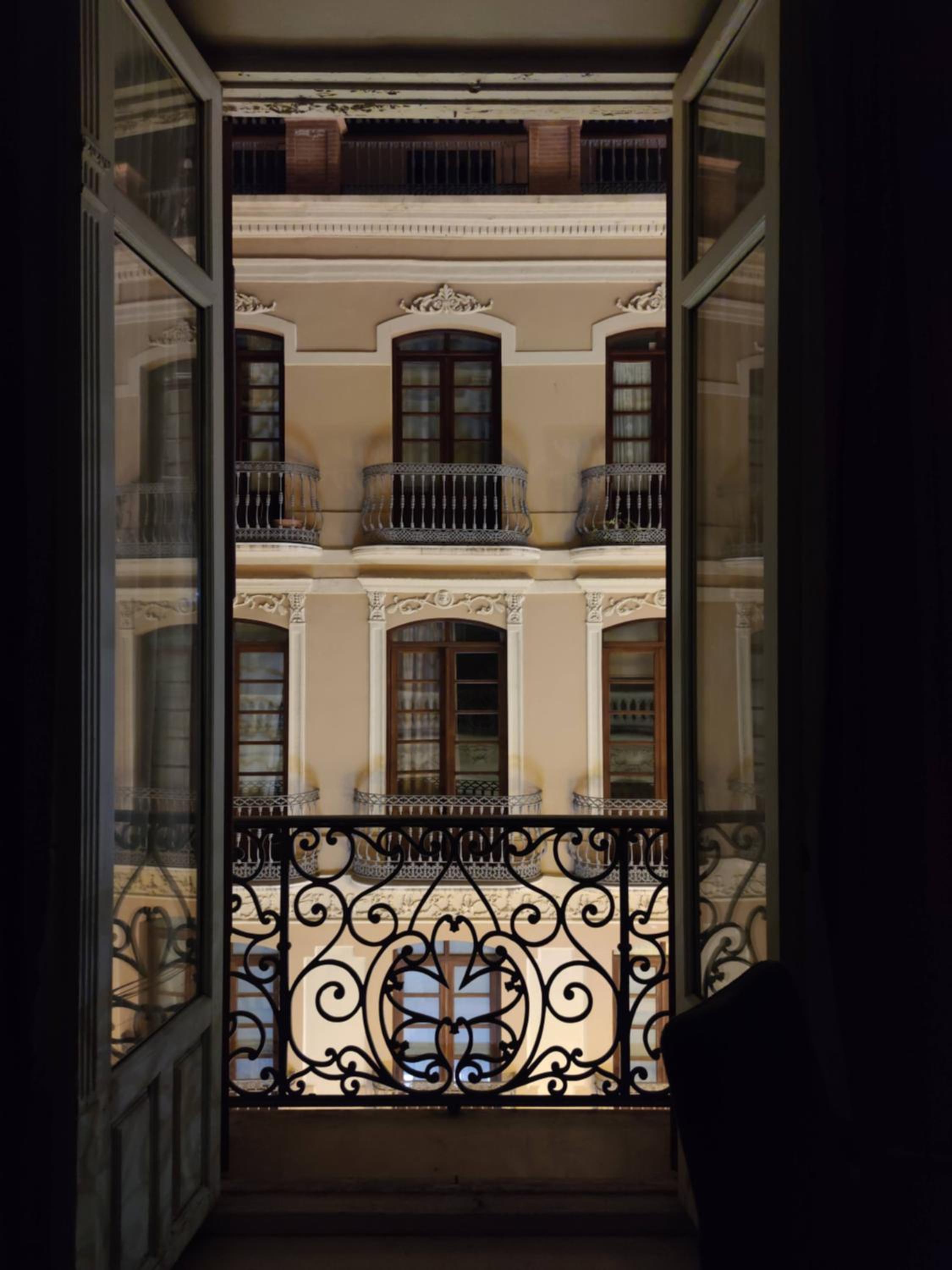 Historic 19th-Century Apartment with Balcony Overlooking Plaza