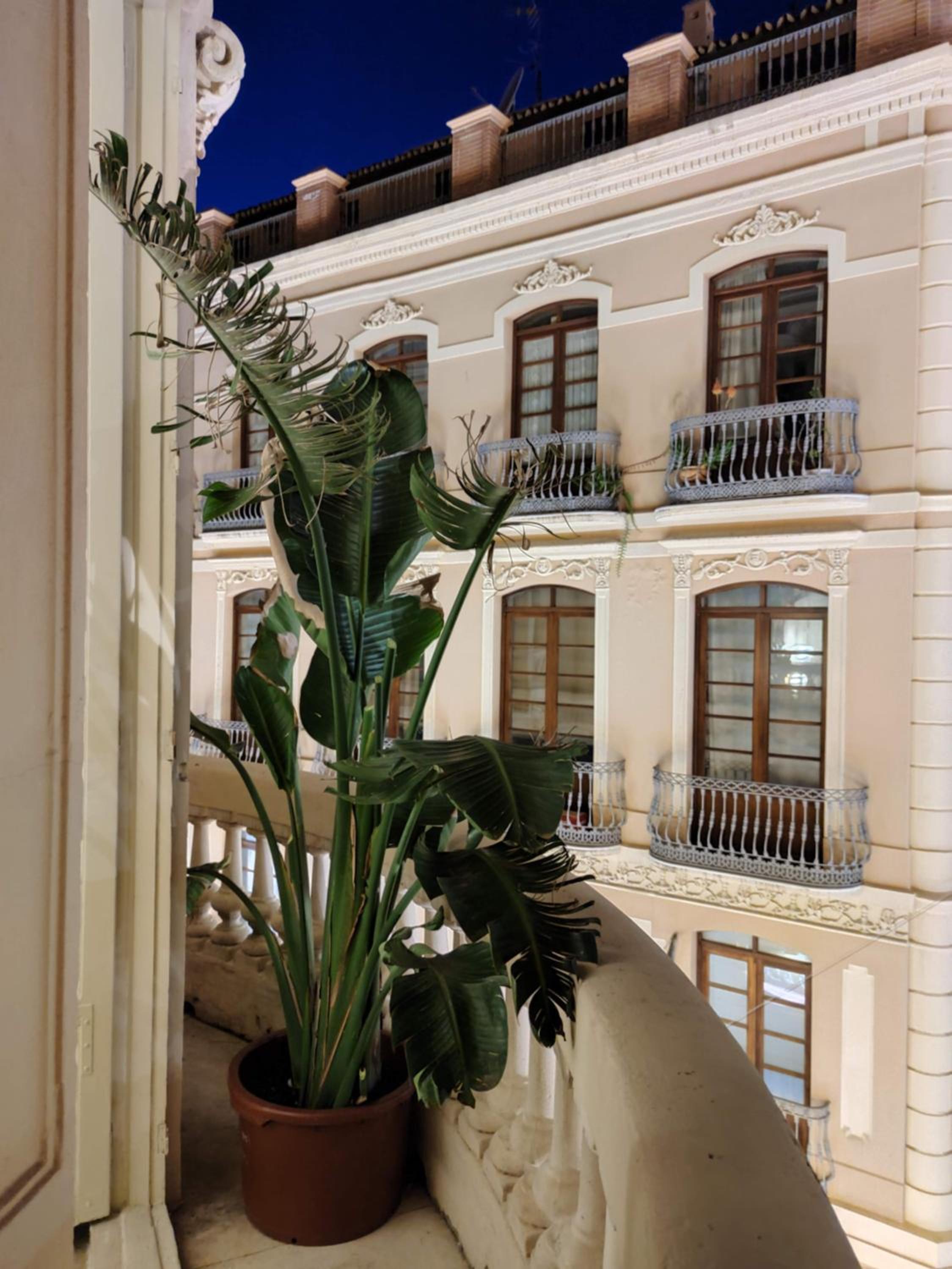 Historic 19th-Century Apartment with Balcony Overlooking Plaza