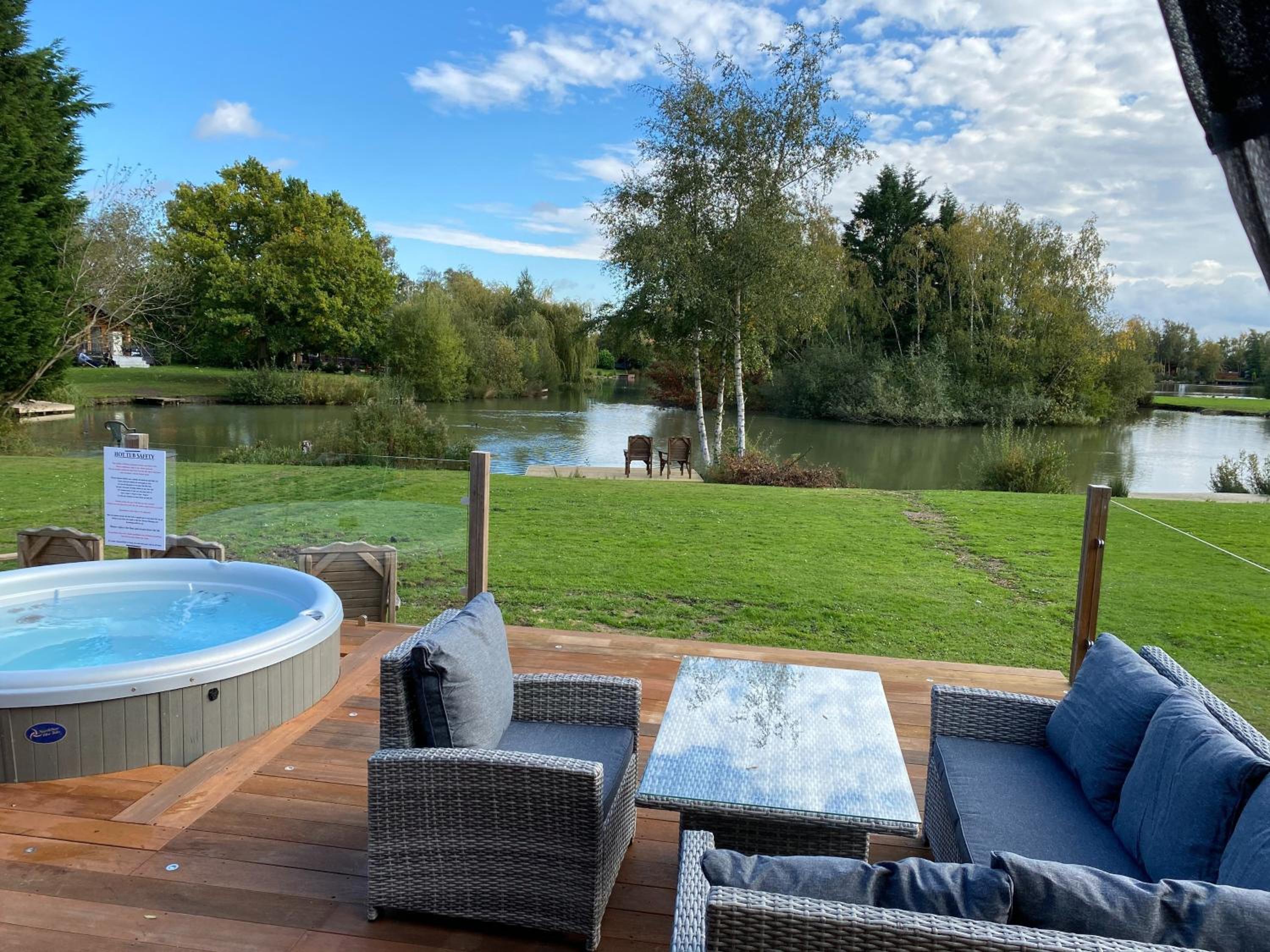 Widgeon Bespoke Cabin is lakeside with Private fishing peg, hot tub situated at Tattershall Lakes Country Park view 3