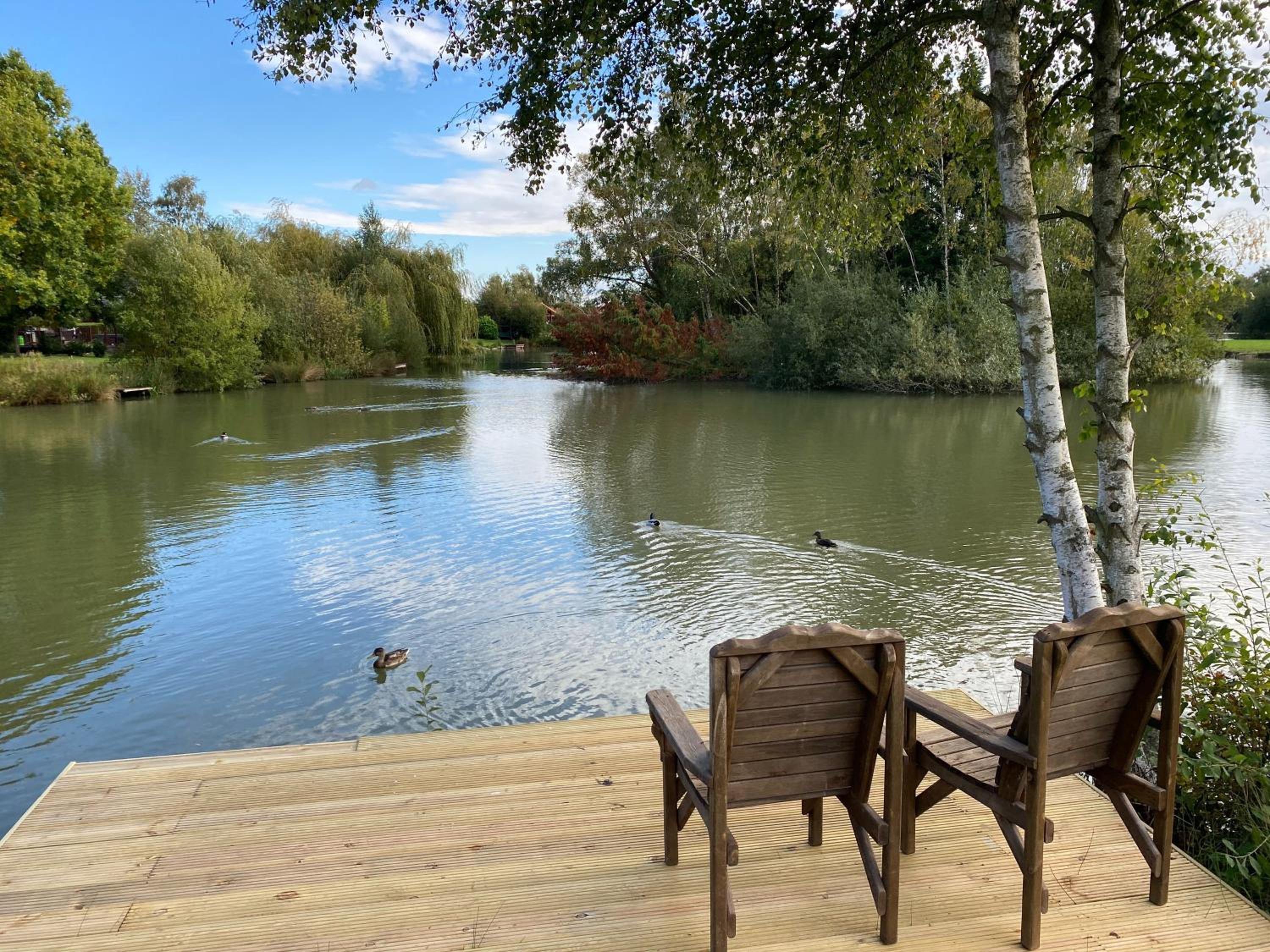 Widgeon Bespoke Cabin is lakeside with Private fishing peg, hot tub situated at Tattershall Lakes Country Park view 2