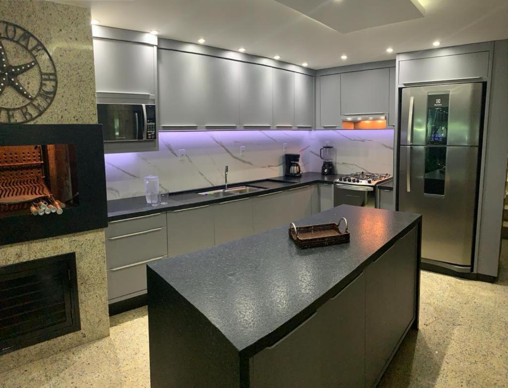 Triplex pé na areia
