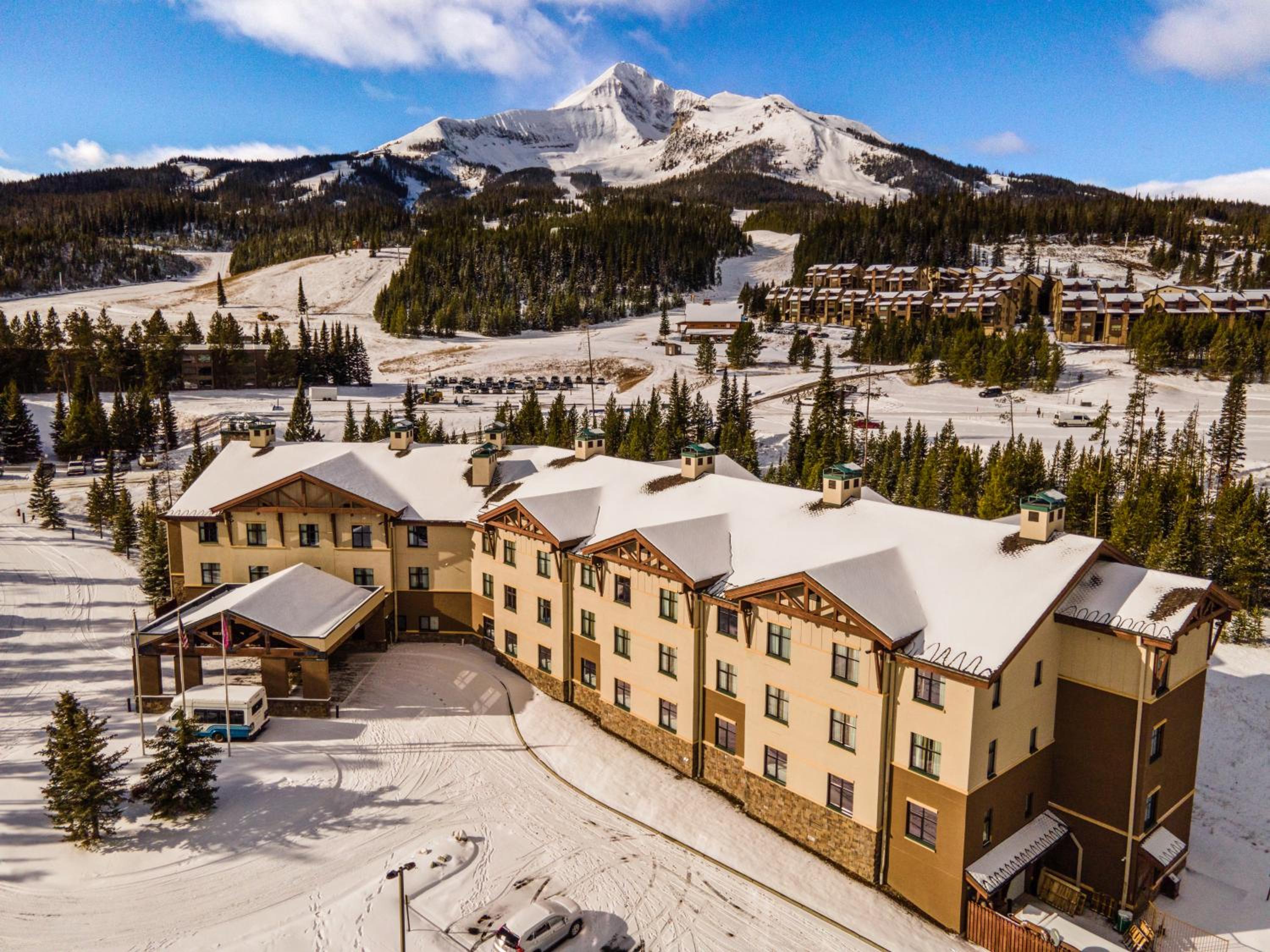 Big Sky ski resort lodging, the Lodge at Big Sky exterior with Lone Peak in background