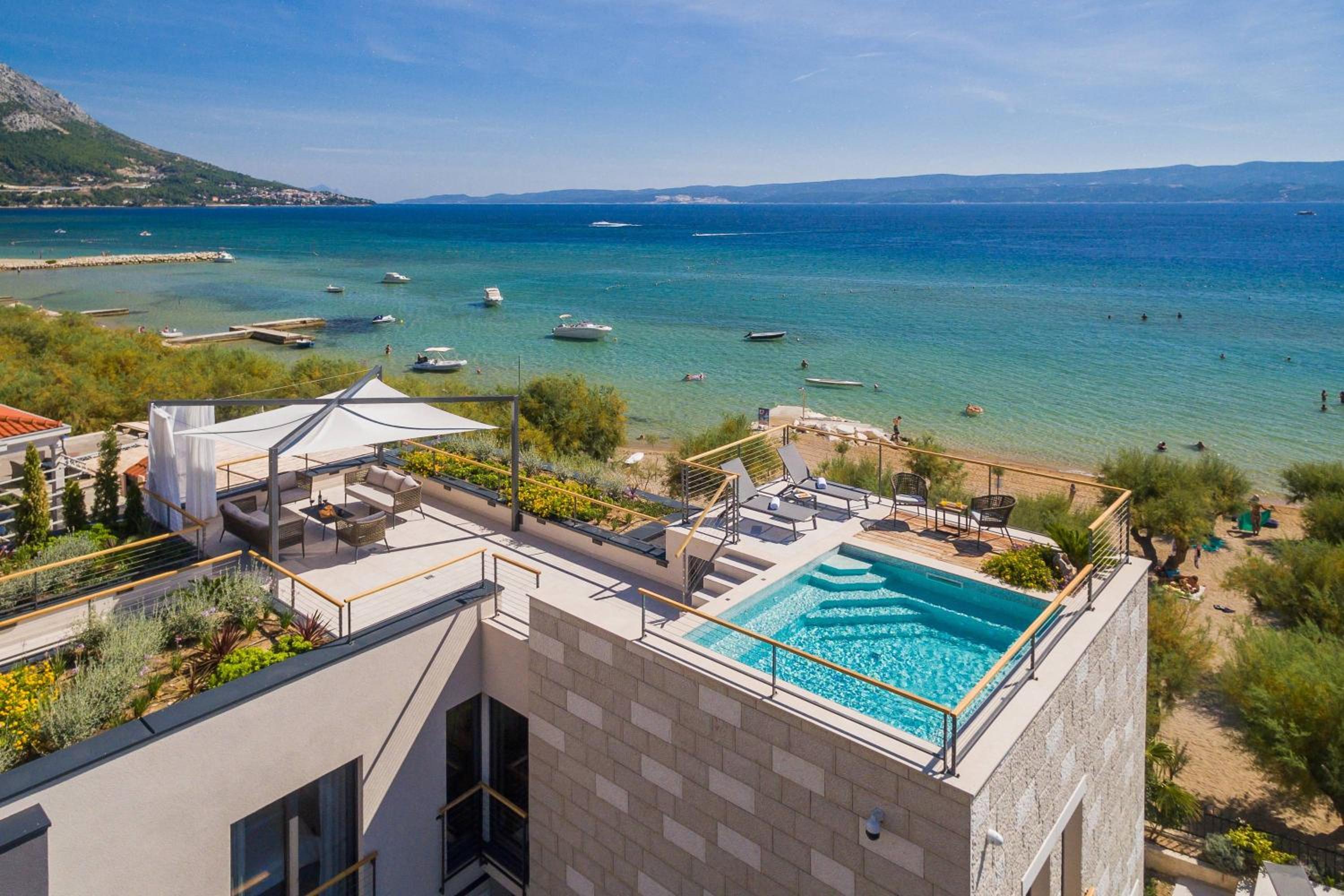 Luxury beachfront VILLA FLORES heated outdoor, indoor pool, whirlpool, sauna view 2