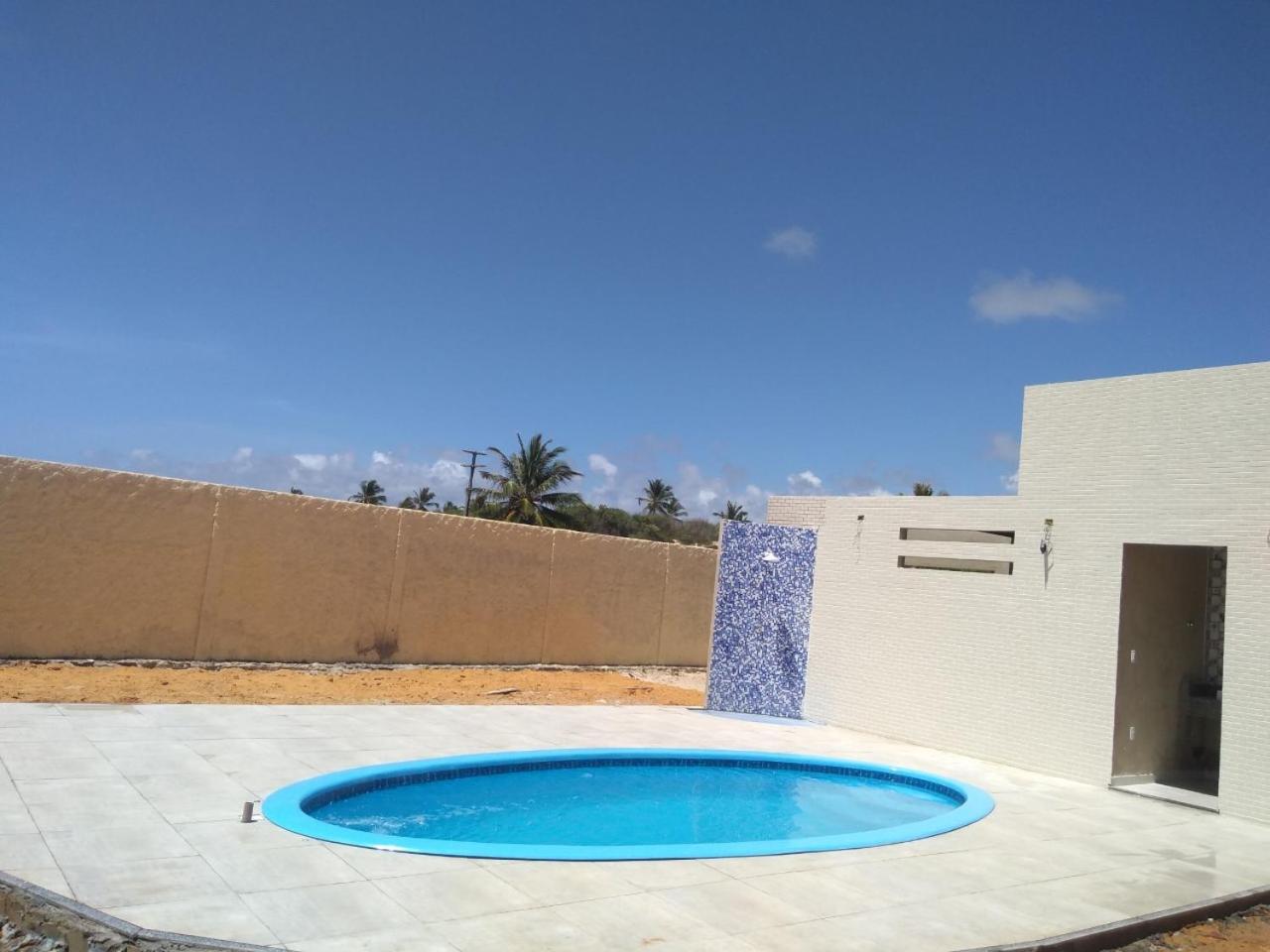 Casa de praia condomínio fechado, frente para o mar