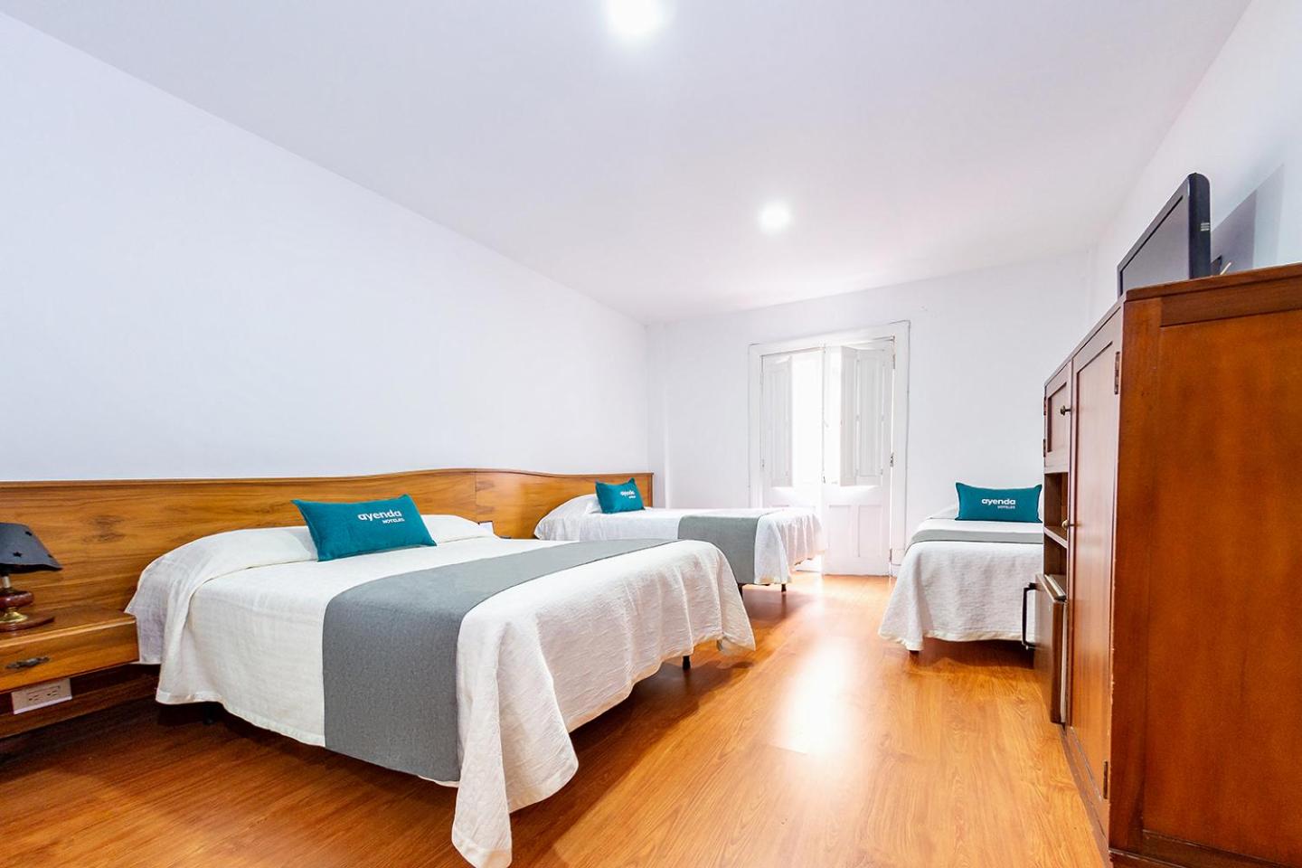 Hotel Escorial, hotel elegante en Manizales — hotel room