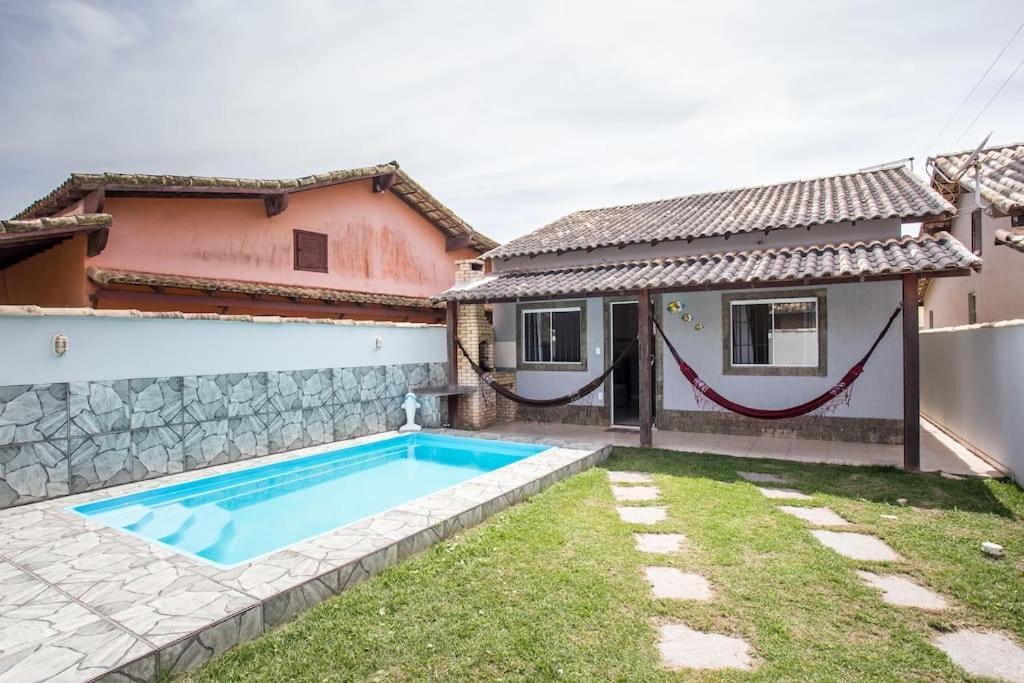 Casa com piscina, wifi e churrasqueira em unamar.