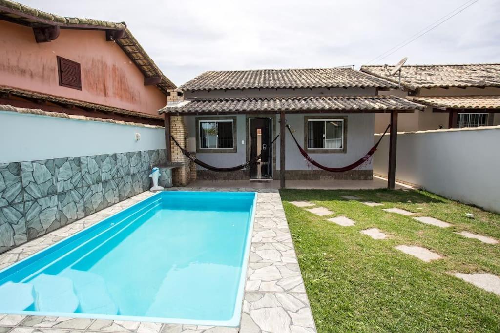Casa com piscina, wifi e churrasqueira em unamar.