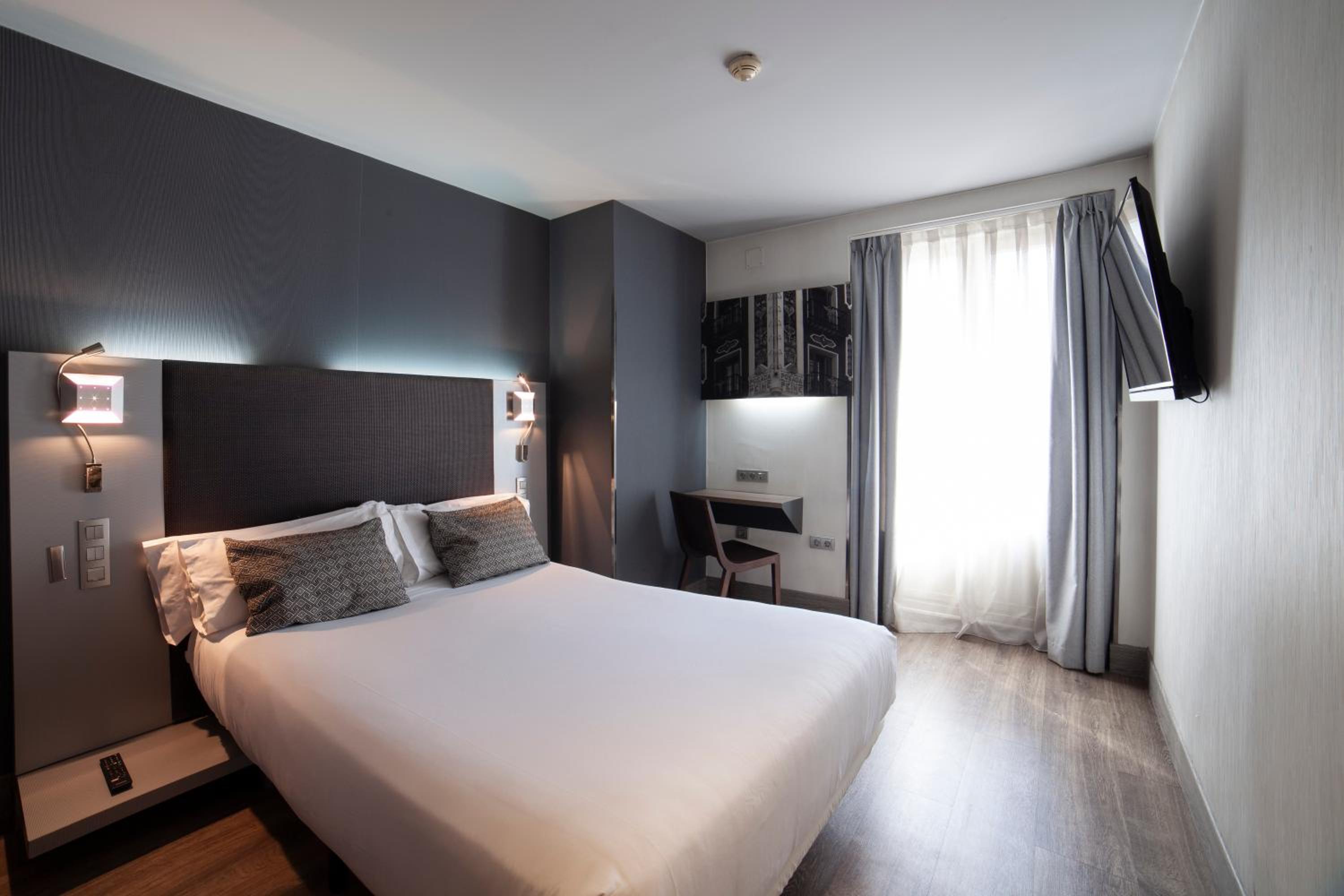 Petit Palace Plaza España en Madrid — bedroom