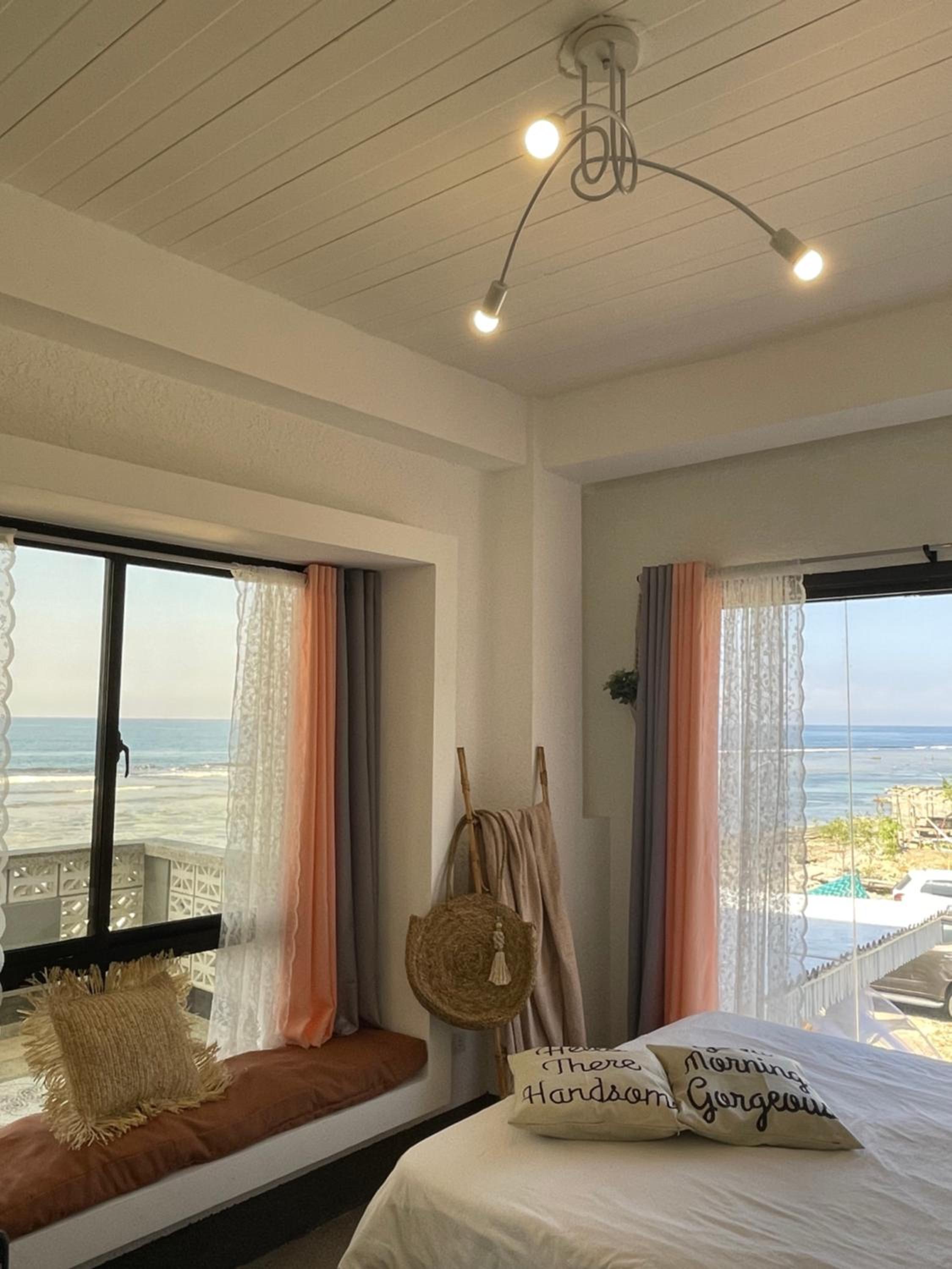 REEF HOUSE BACNOTAN beige sand beach front with Swimming pool