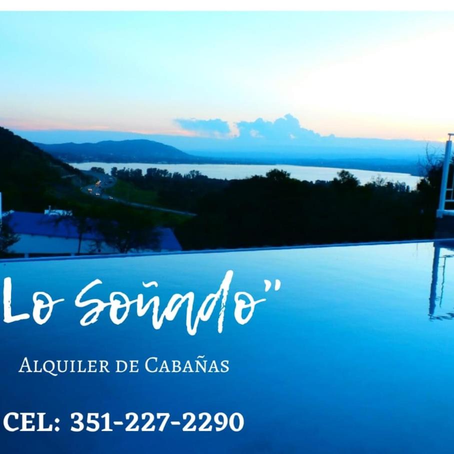 Cabaña frente al Lago San Roque Vista única pileta infinito wifi