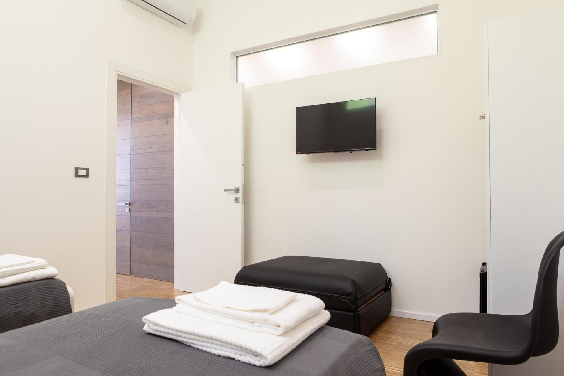 AC Home en Novoli — hotel room