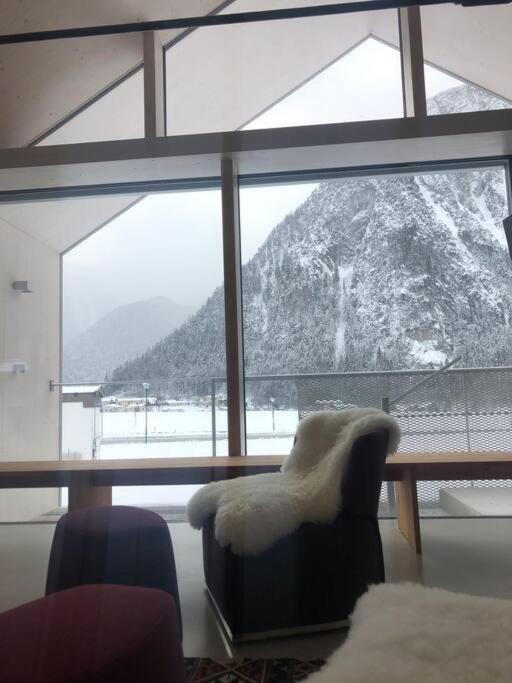 Modern Alpine Penthouse with Lake View