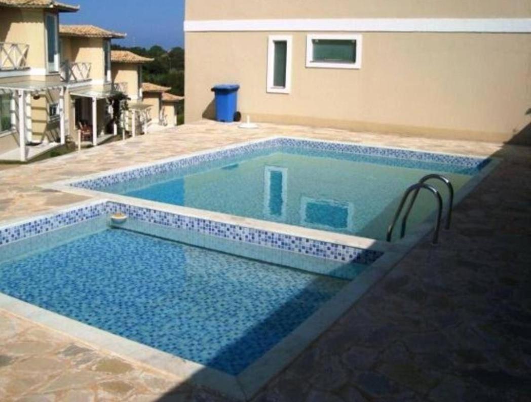 Casa em condomínio com piscina na Praia Rasa