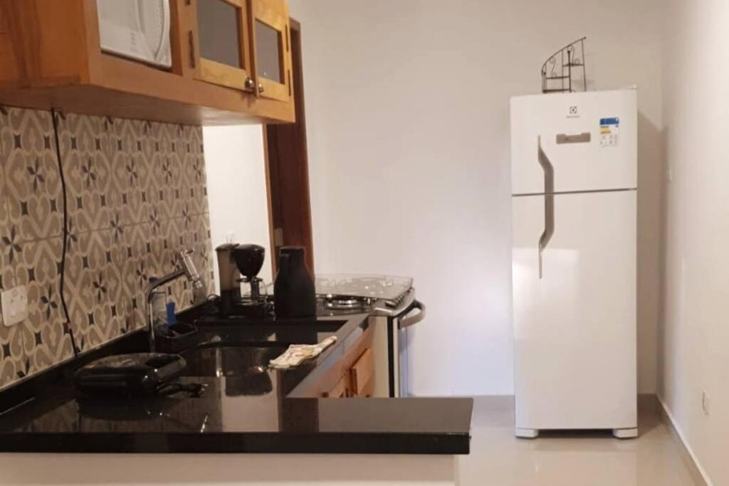 Casa com varanda, ar condicionado pet friendly