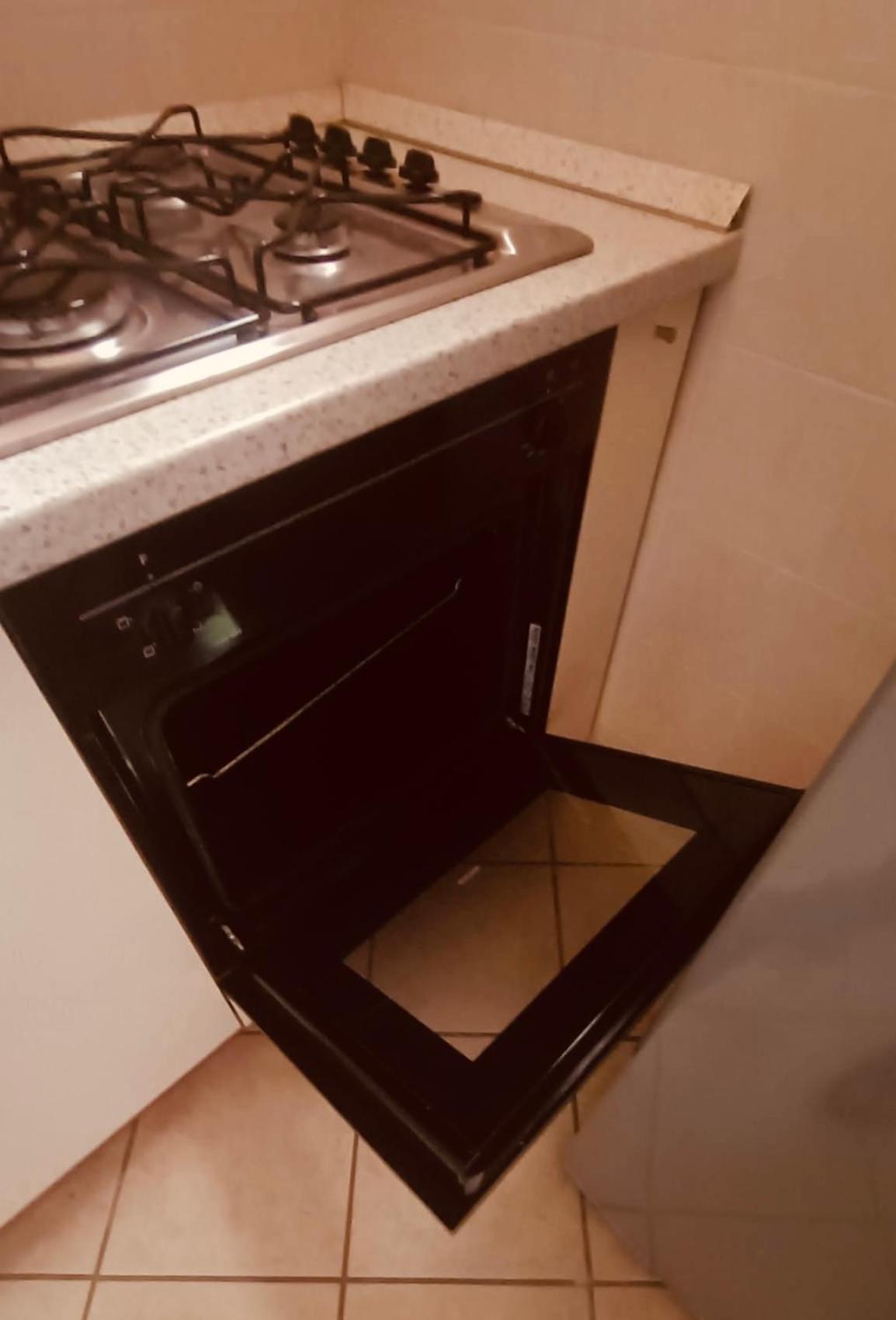 Twinfins apartments en Buggerru — kitchen
