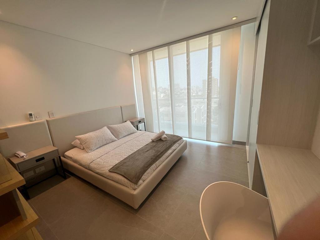Distrito 90 - Estudios y Apartamentos para vacaciones y viajes de negocio